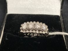 Jewellery: White metal ring set with four brilliant cut diamonds, estimated weight of (4) 0.80ct,