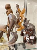 20th cent. Treen carved figurines tribesman and woman, plus four other figures.