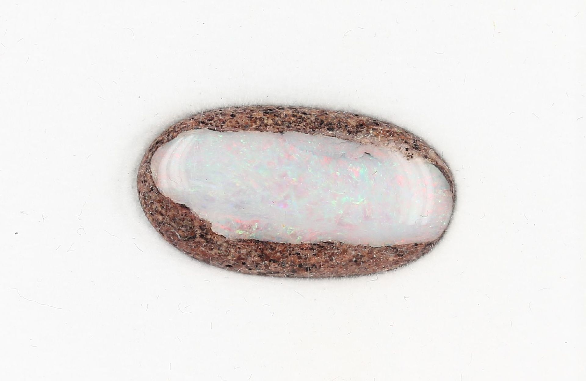 Loose boulder opal approx. 6.73 ct , play ofcolours in red, yellow and green