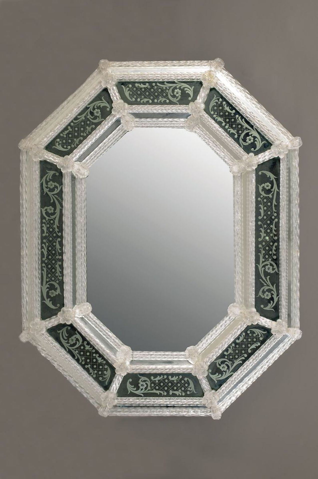 Large mirror, Venice, end 20th c., elegant rectangular shape, with turned bars and fittedflower