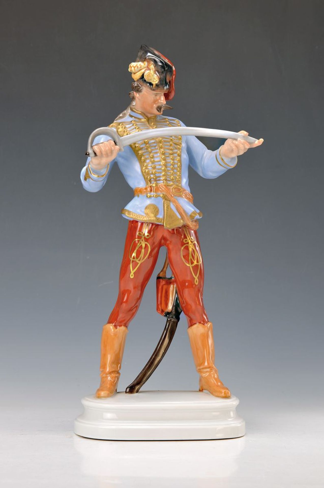 large figurine, Herend, standing Hussar examining the rapier blade, Model no. 5505, polychrome
