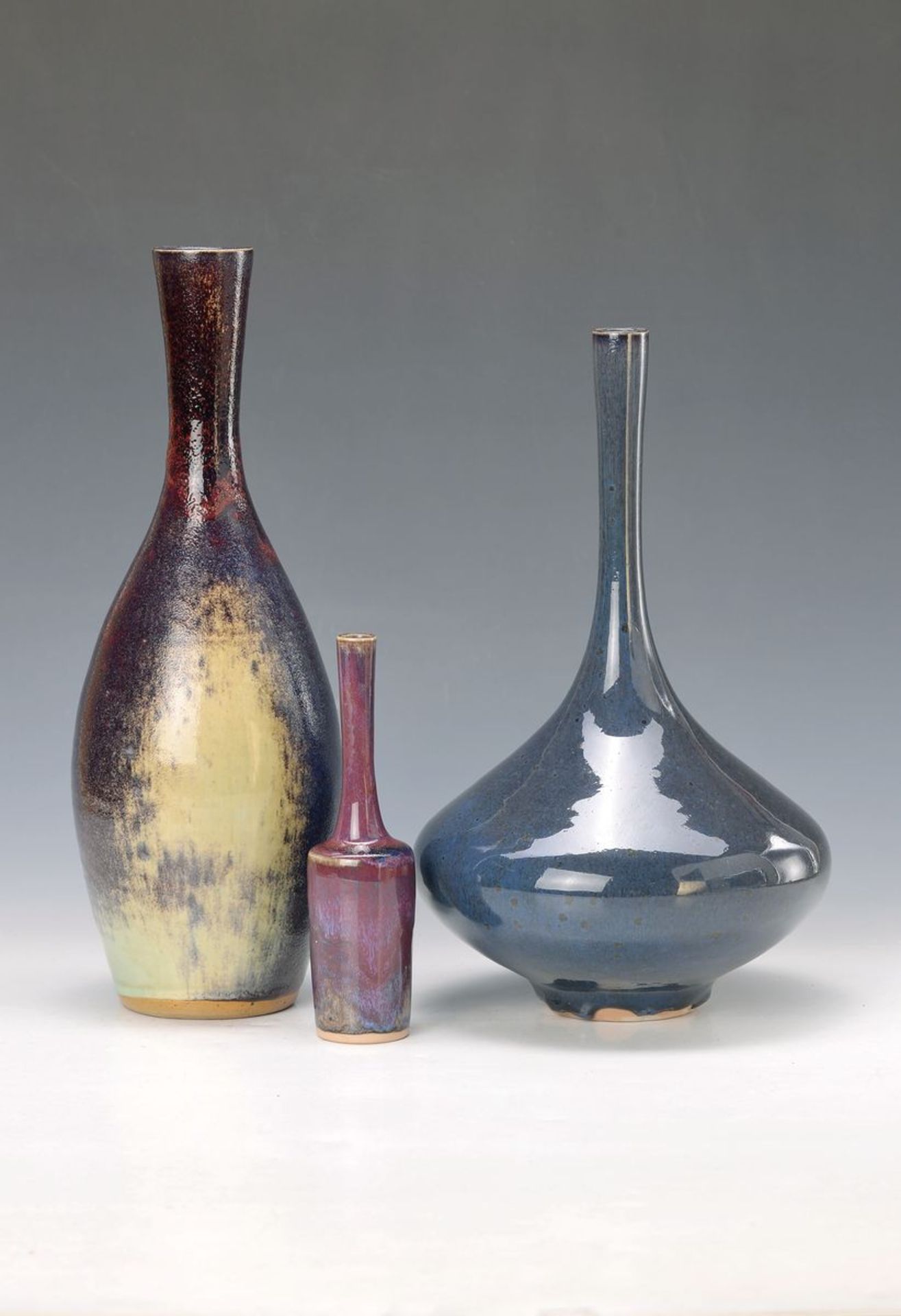 lbrecht Hohlt, Katzbach, three vases, stoneware with elaborate reduction glazes: bellied bottle