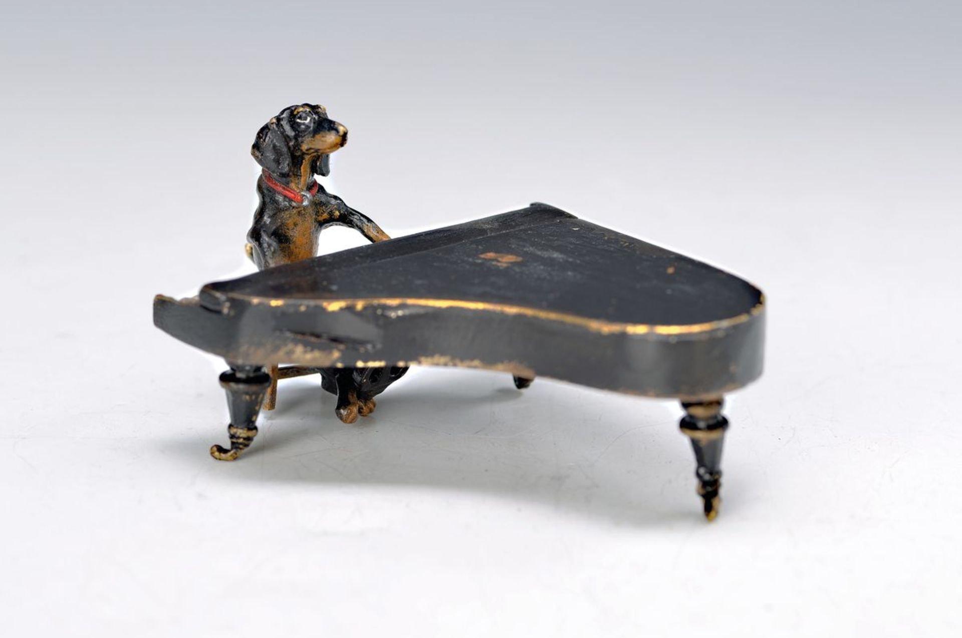 Vienna Bronze, 2.H.20.th. century, dachshund on leaves, colorful painted, signed Bergmann, H. 5