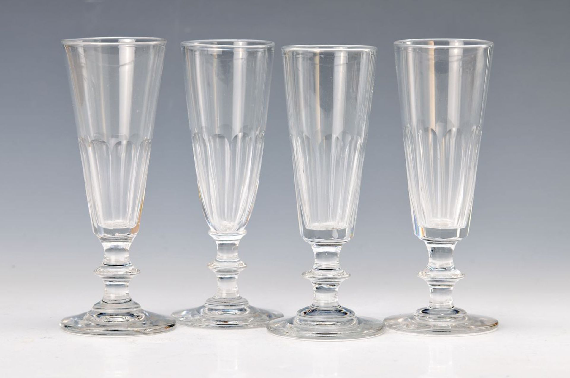 6 champagne glasses, France, around 1900, colorless glass in lower part faceted, H. eachapprox.