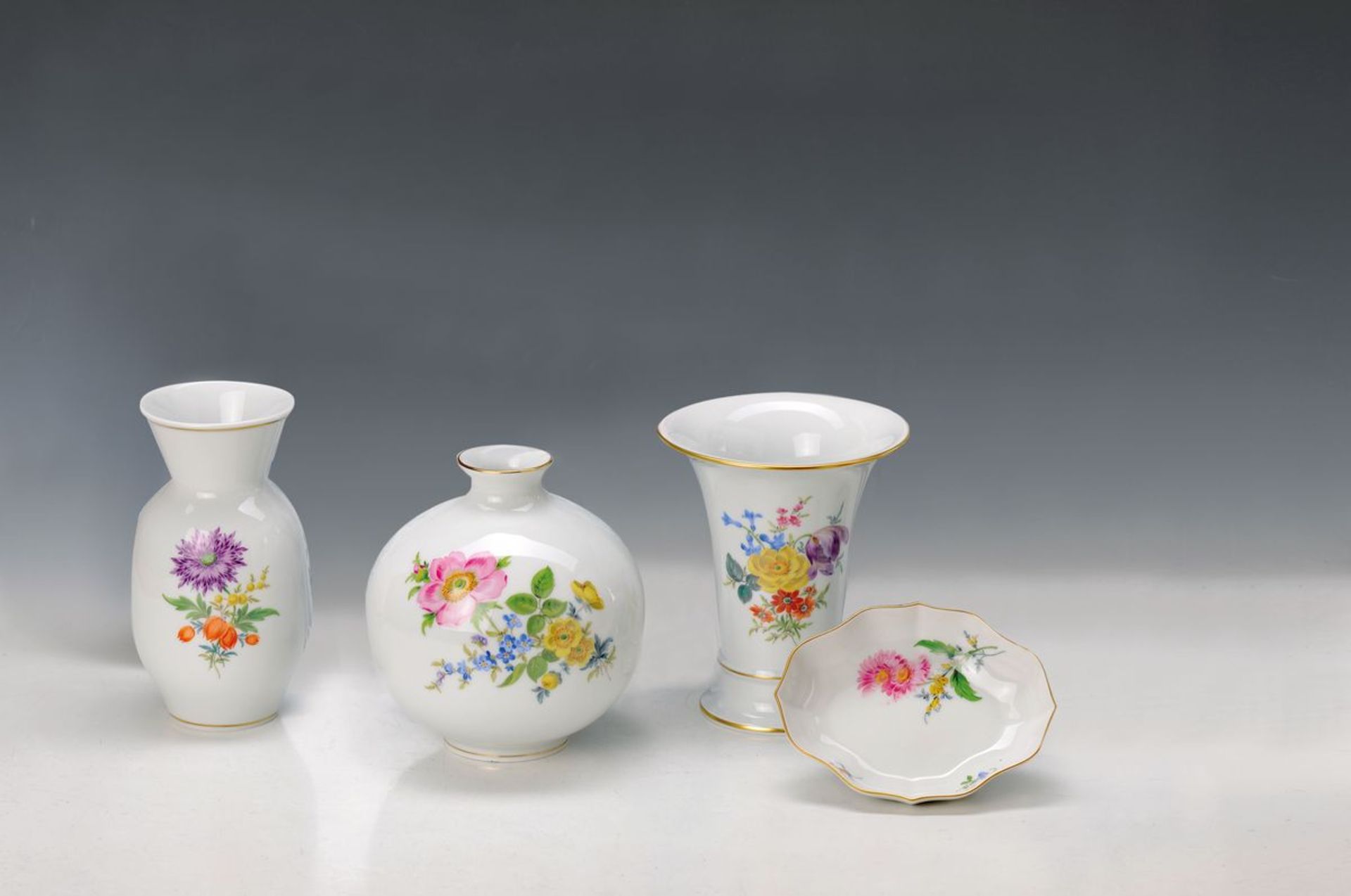 9 parts Meissen, flower painting, 2. Half 20.th c., ball vase H. 17 cm, two vases H. 17 -18.5 cm,