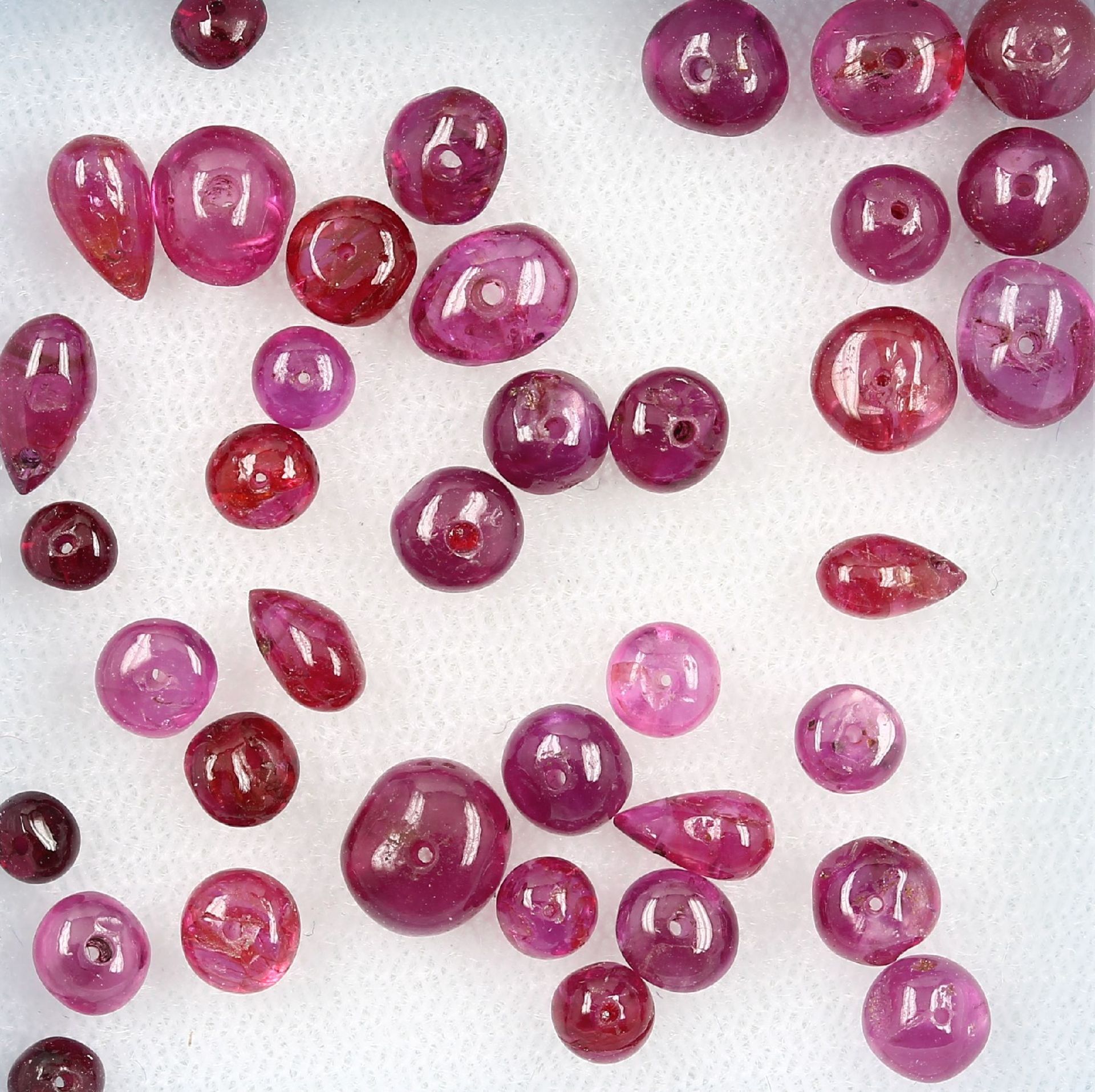 Lot loose rubylinses total 32.49 ct , drilled, (treated) Valuation Price: 1600, - EUR