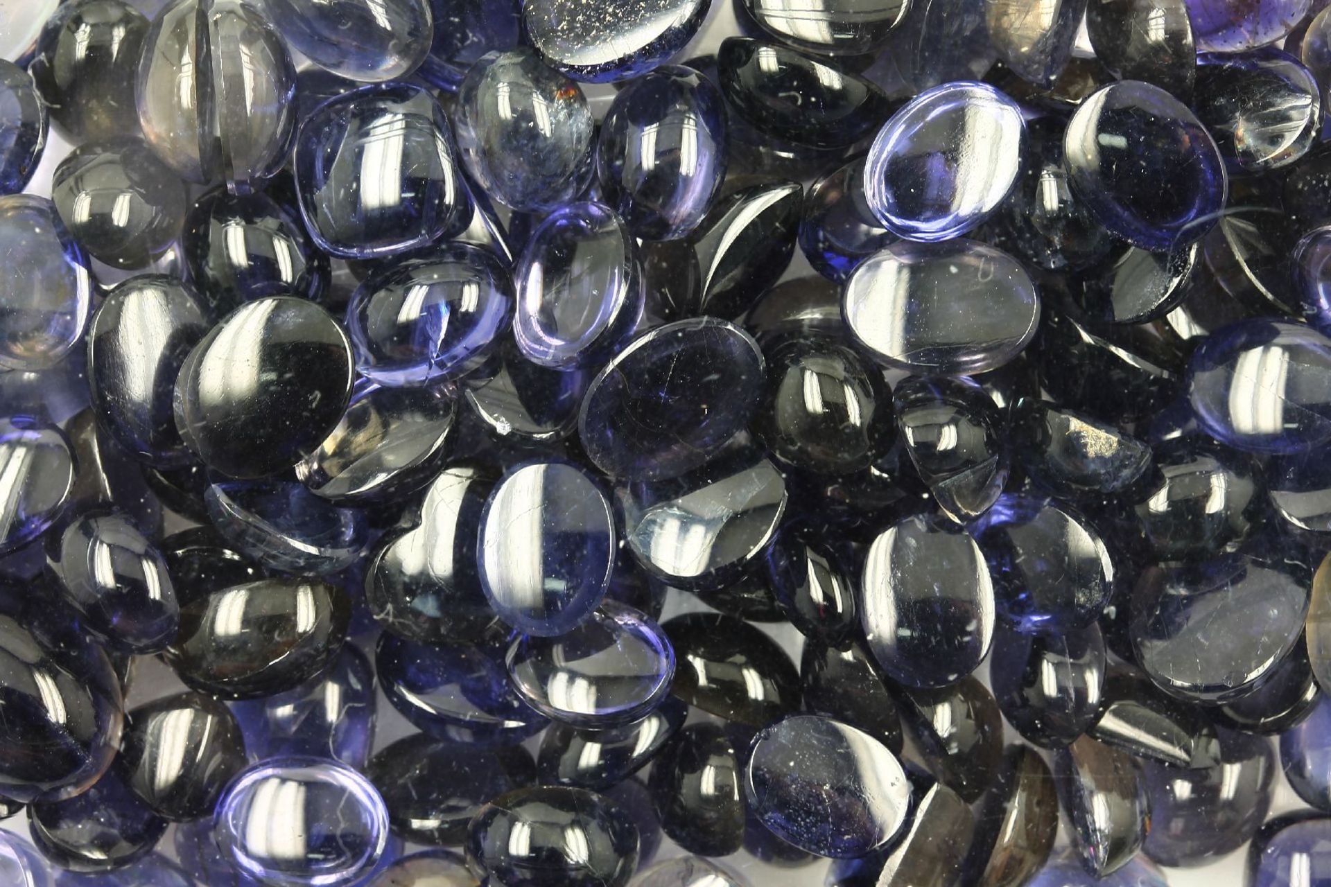 Lot loose iolite-cabochons total approx. 327 ct , different shapes, dismounted