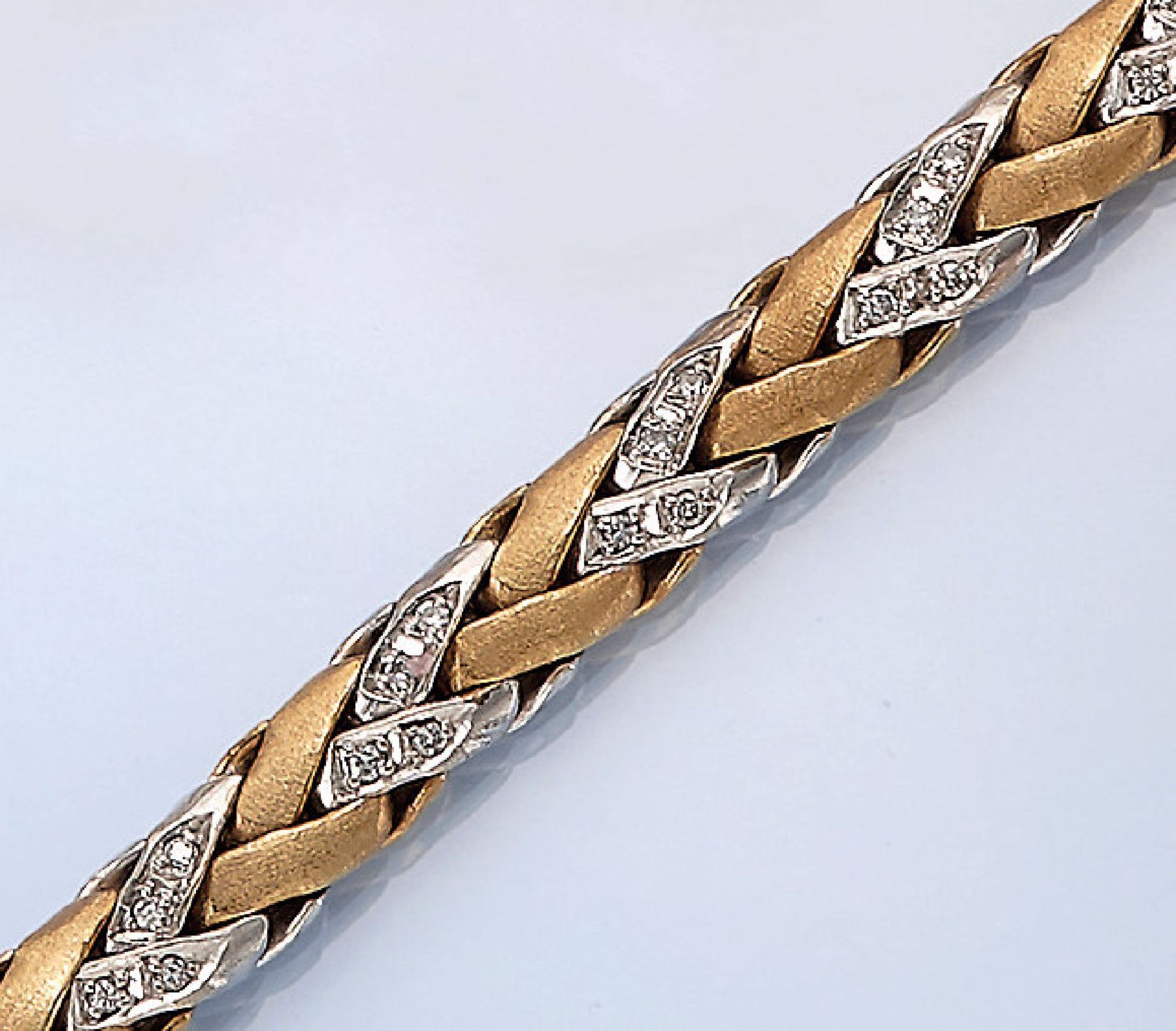 14 kt gold bracelet with brilliants , YG/WG 585/000, partly in WG, respectively in YG, satin