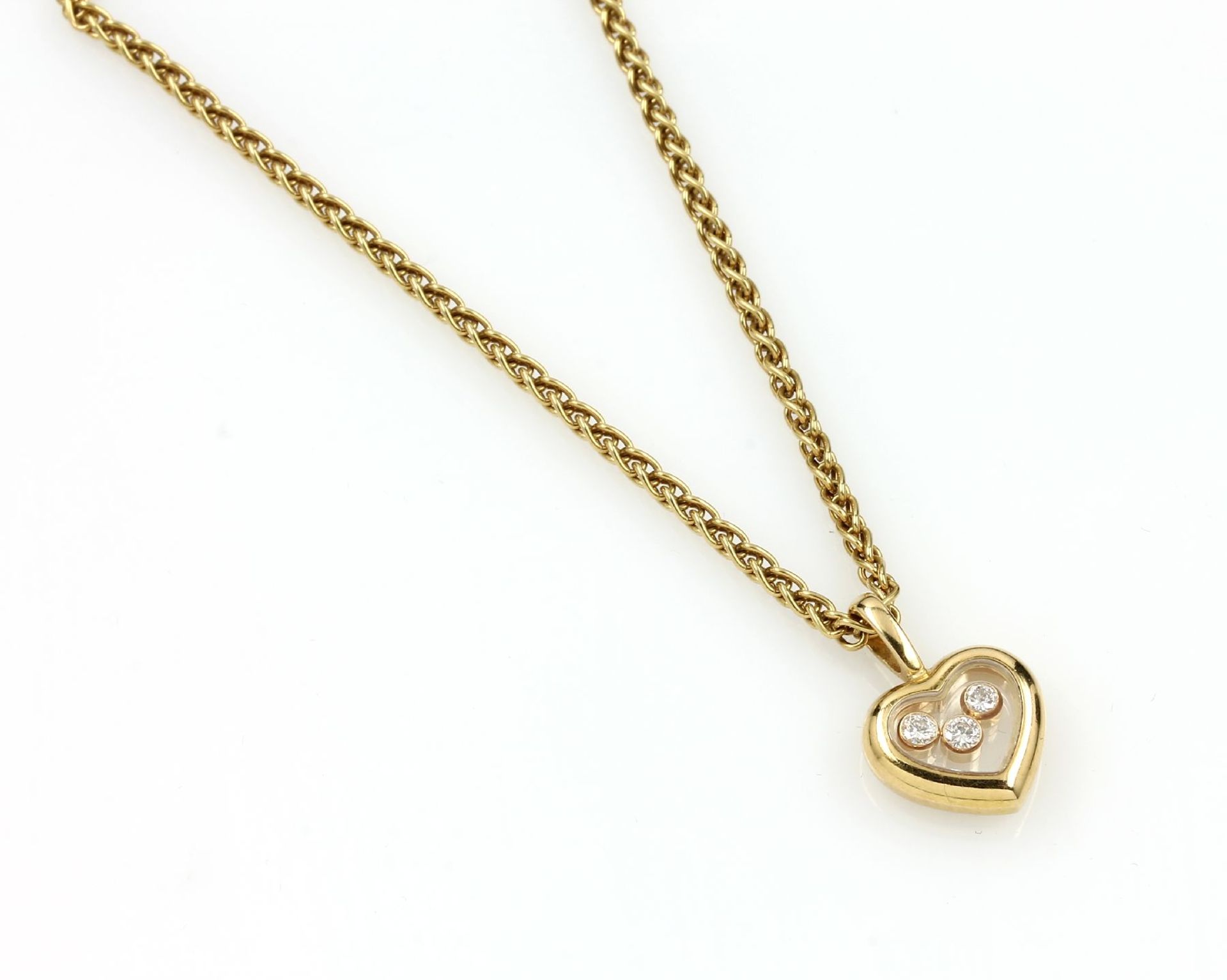 18 kt gold CHOPARD necklace heartpendant "Happy Diamonds" with brilliants , YG 750/000, 3 brilliants