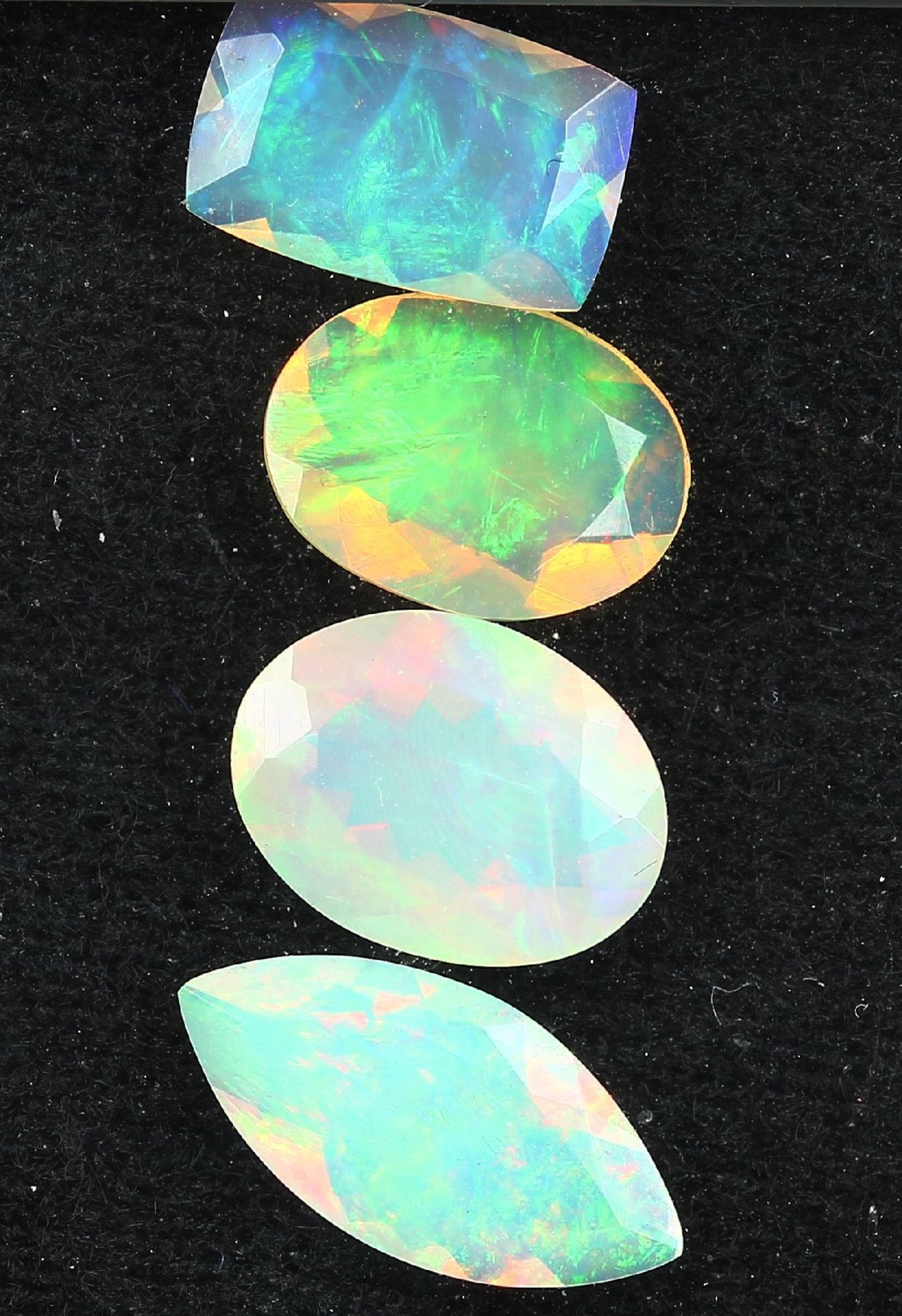 Lot 4 loose opals , total approx. 5.15 ct, 2x oval, 1 x marquise, 1 x baguette, with nice play of