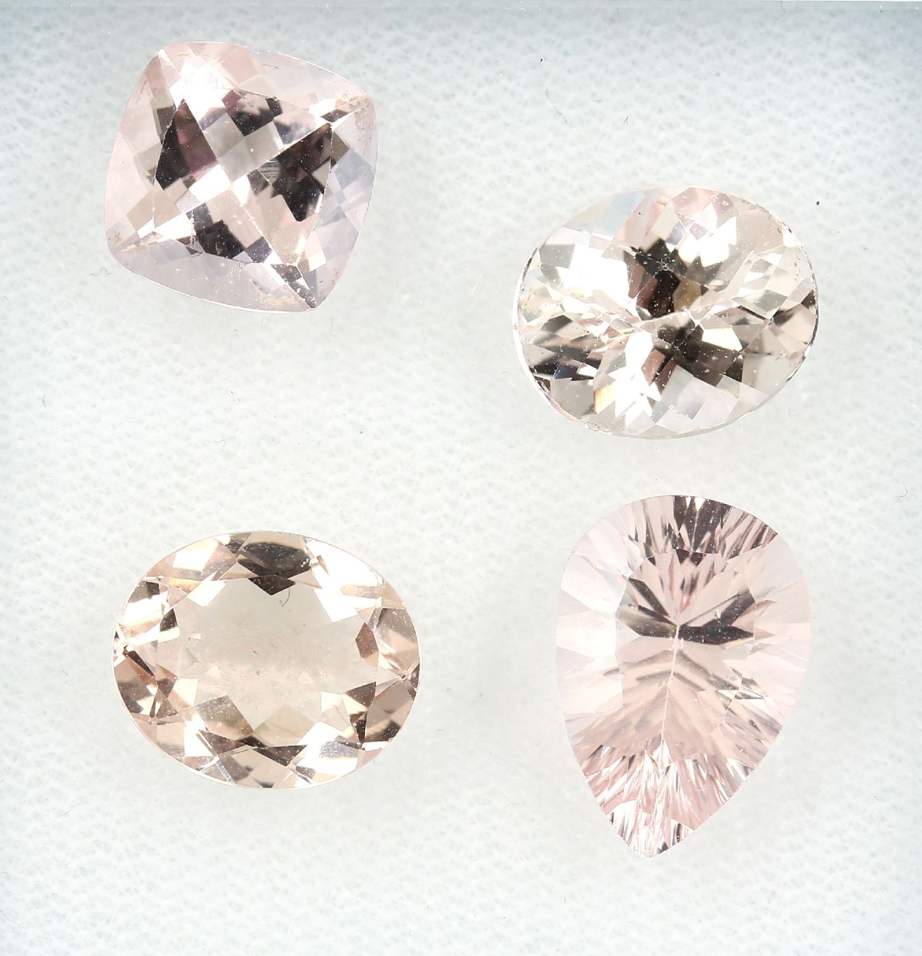 Lot 4 loose morganites , total approx. 16.64ct, comprised of: 2 x oval bevelled, 1 x cushion cut and