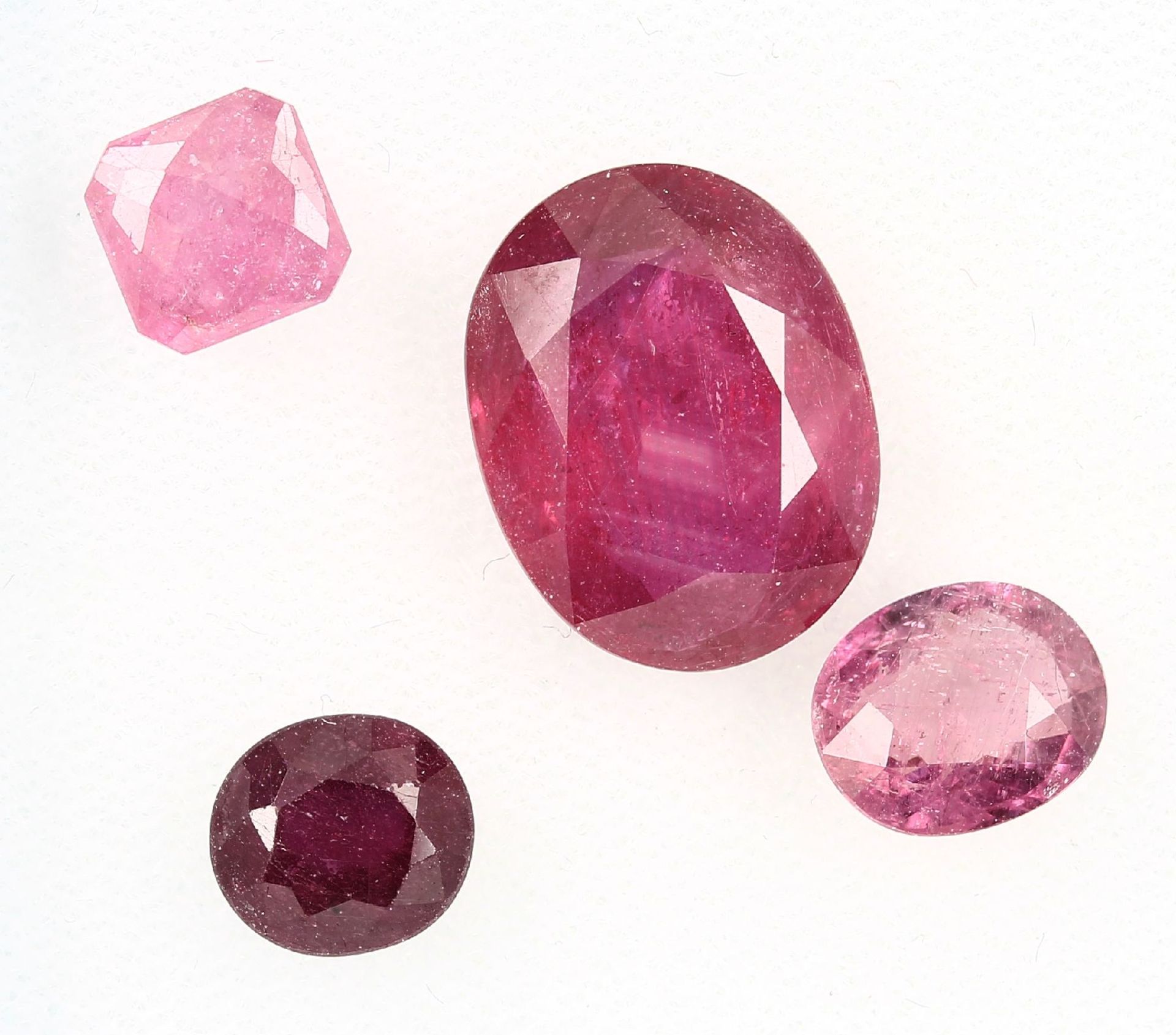 Lot 4 loose rubies , total approx. 17.69 ct,in different cuts and sizes, partially dismounted