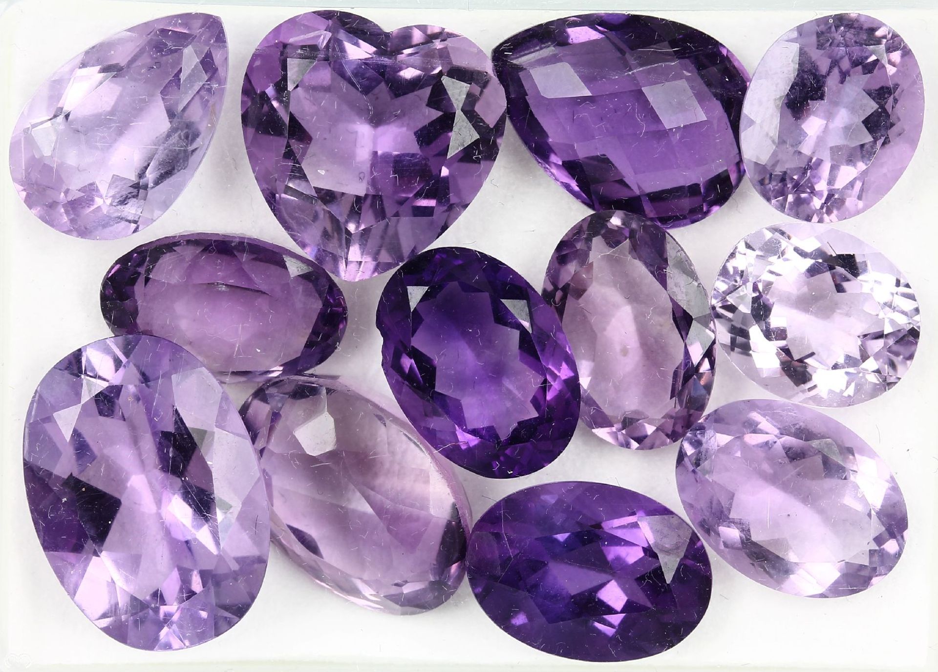 Lot 12 loose amethysts , total approx. 80.83ct, in different cuts and sizes, predominant oval (1