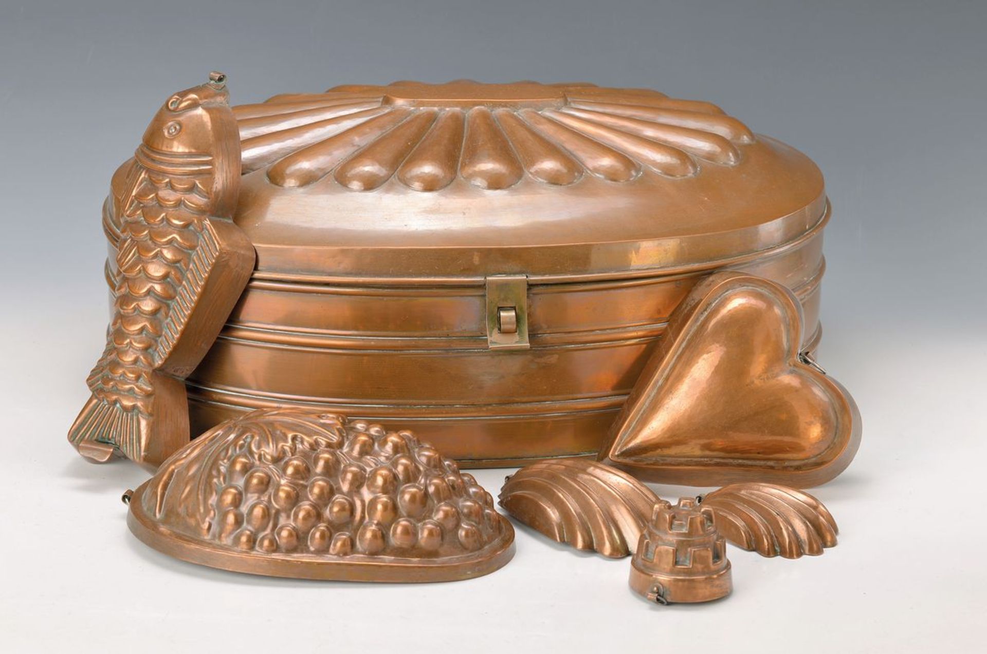 Large, oval, copper bread box and in addition five copper mould, German, 19th c., interior tinned,