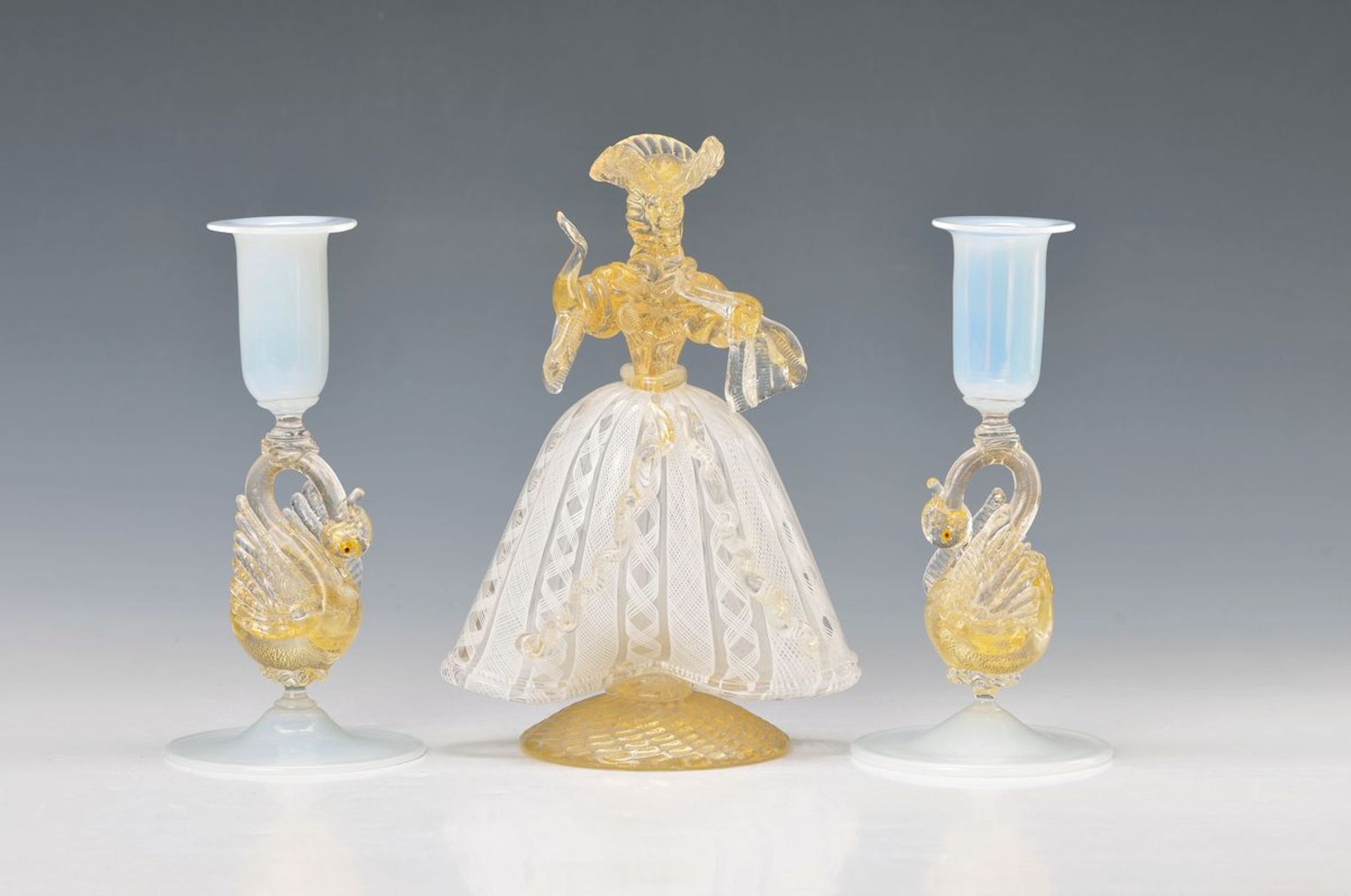 Sculpture and two candlesticks, Murano Italy, blown glass with melted gold powder and white spirals,