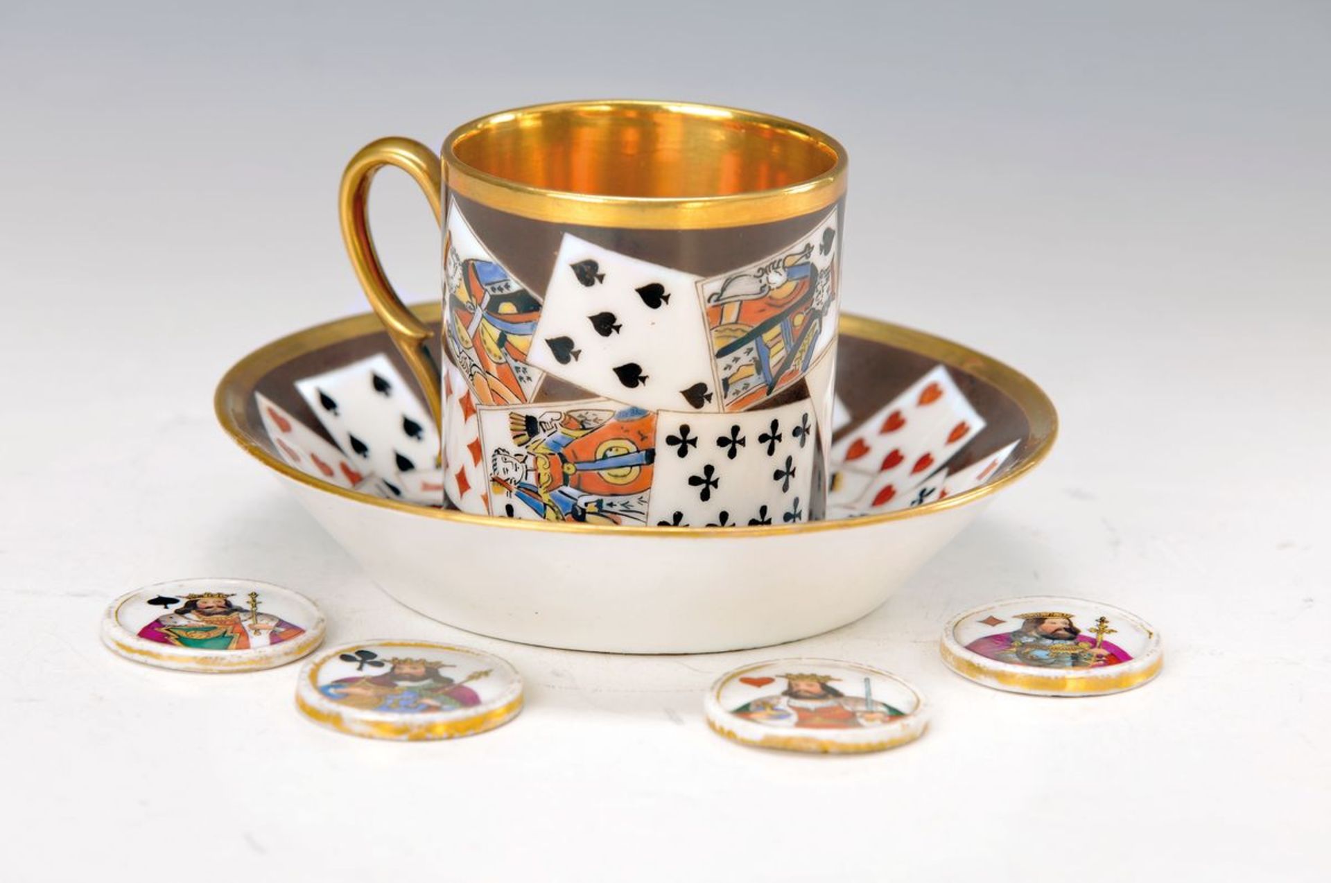 cup with saucer, Paris, around 1830/40, polychrome decor of playing cards on brown ground, fine