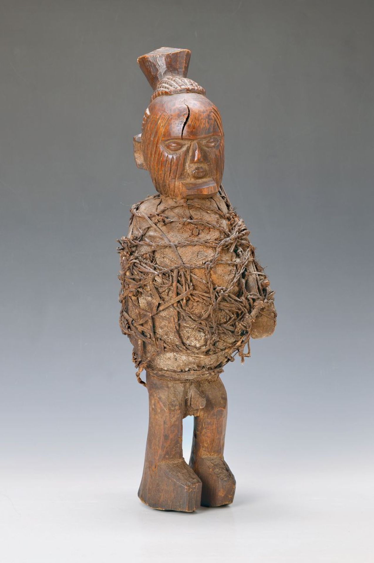 Fetish figure the Bateke, Central Africa, approx. 60 years old, carved wood, wrapped with shawl