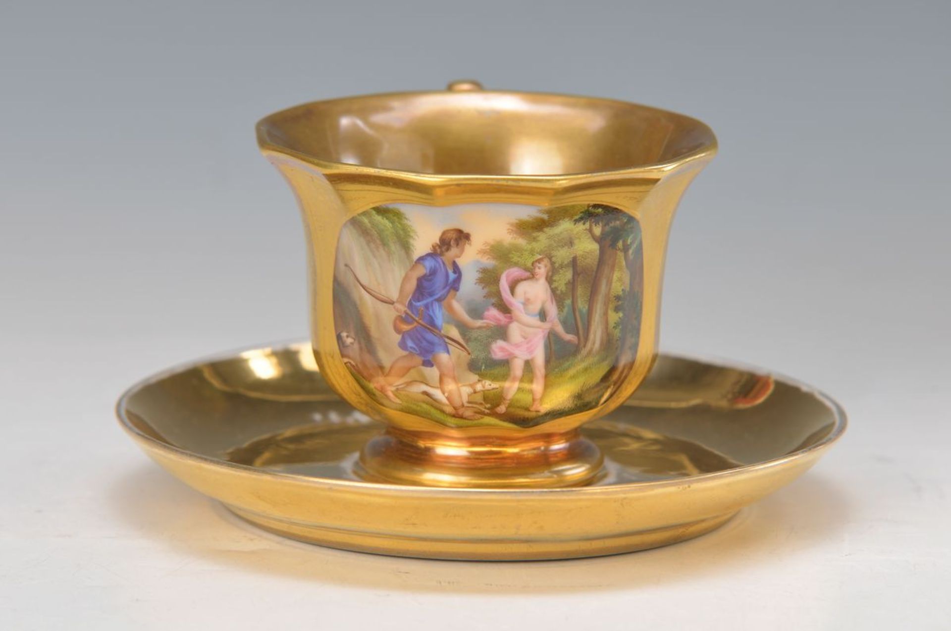 cup with saucer, German, Middle of 19th c., porcelain, interior and outside gilt, in cartridge