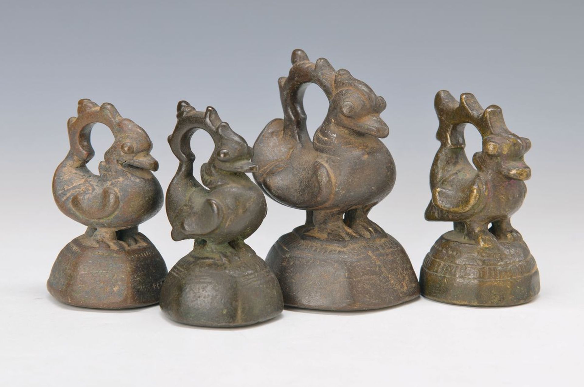 Four weights, India, around 1830, brass in shape of ducks with handle, slightly different, H.