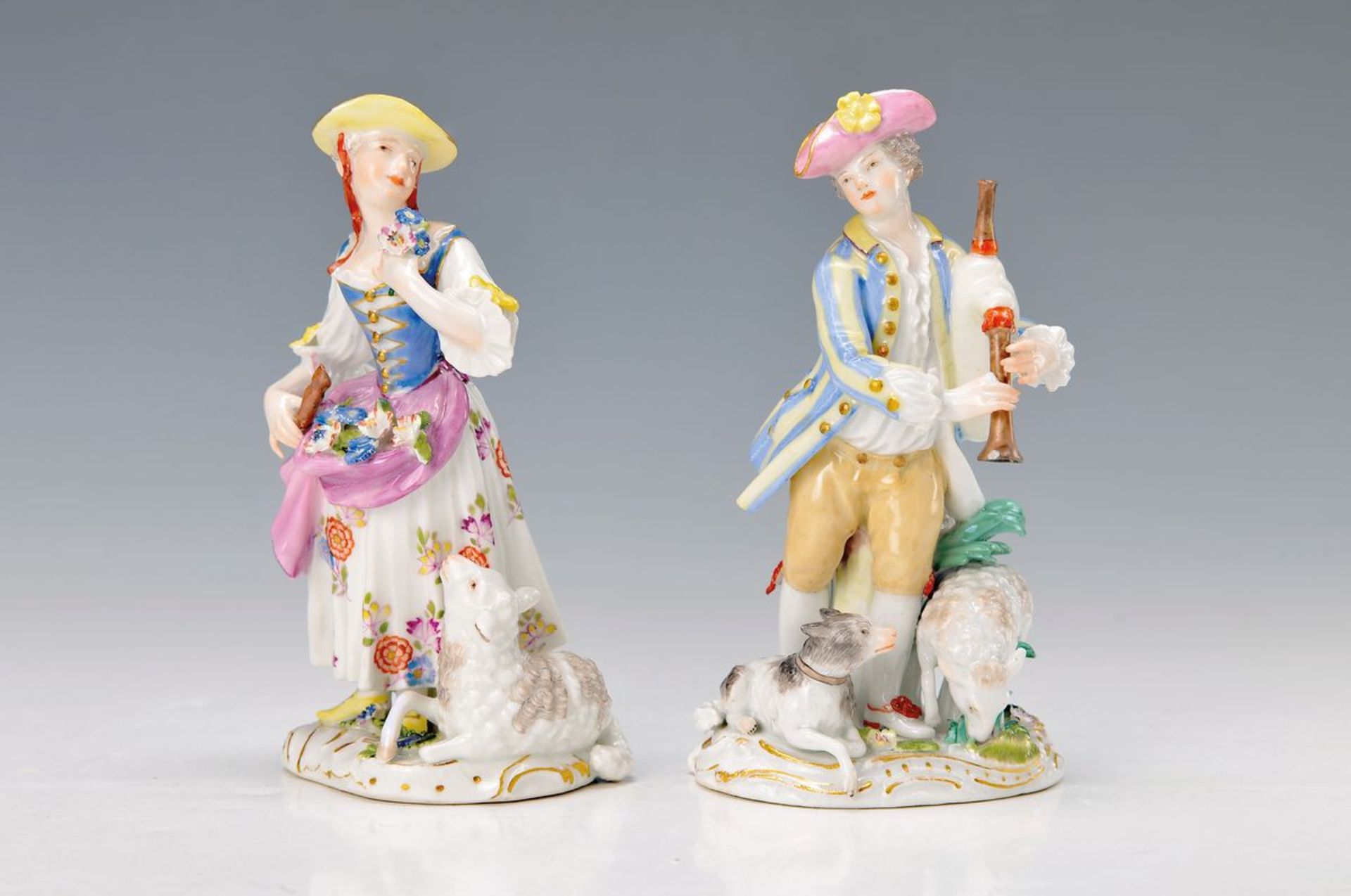 pair of figurines, Meissen, 1770/80, couple ofshepherds, girl with flute, flowers in the apron and