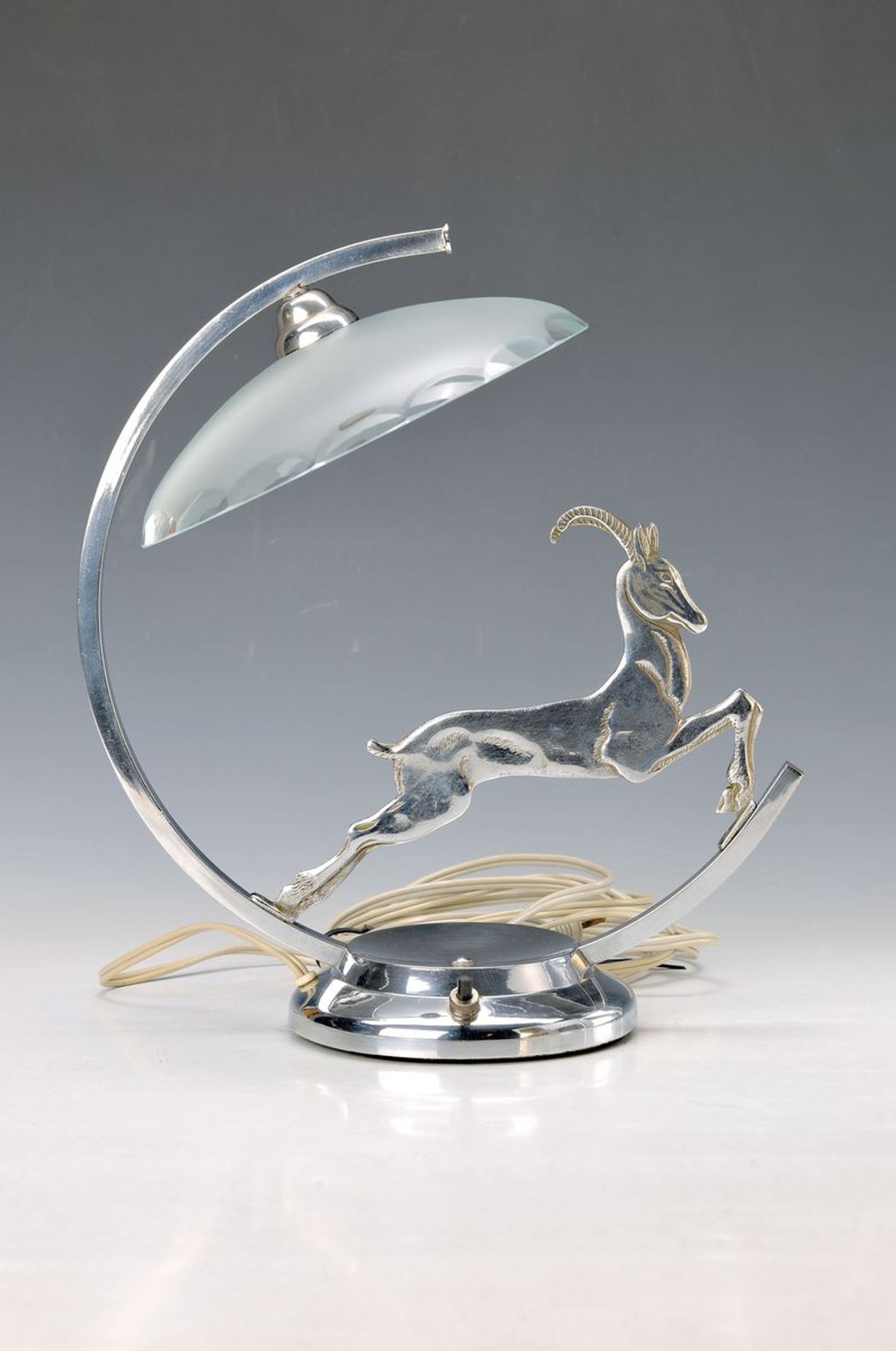 species-Deco-table lamp, France, 1930s, nickelplated metal, decor of a jumping chamois, glass lamp