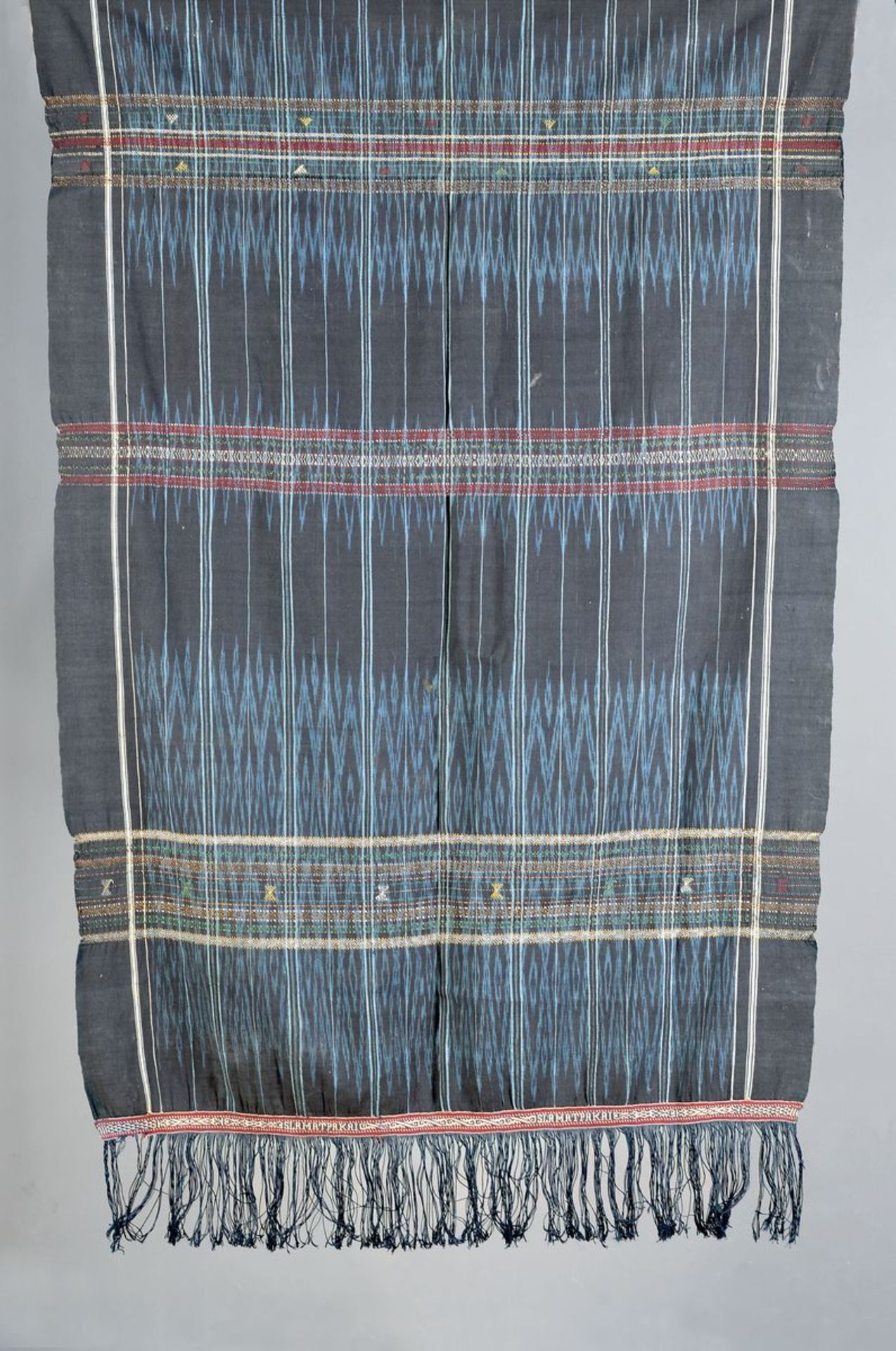 three ceremonial wraps, Toba-Batak, cotton Kettikat: a. L.approx. 204 plus fringes, W approx. 47 cm,