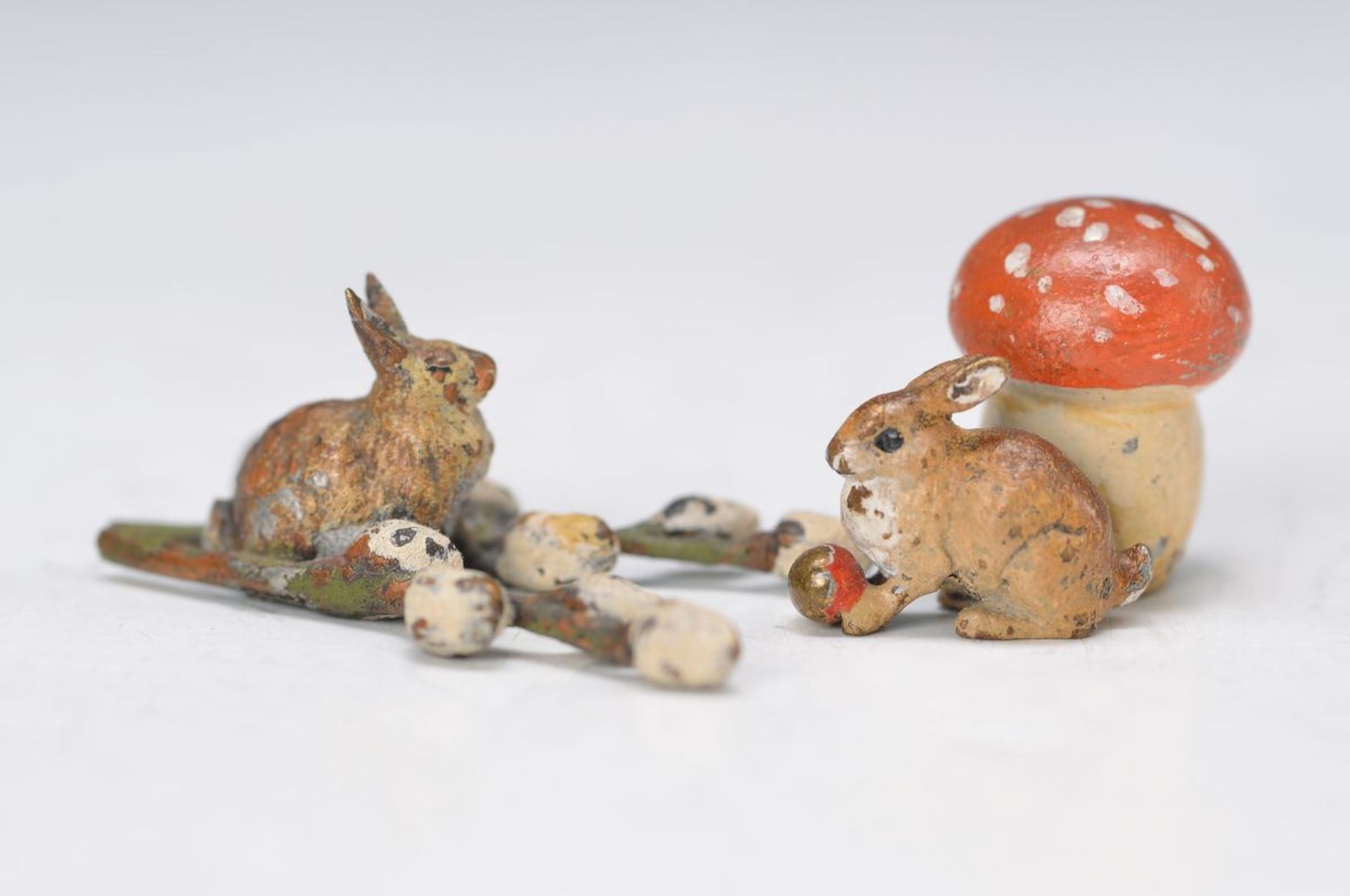 two Vienna Bronzes, a. rabbit with pussy willow, approx. 1x4x2.5cm; rabbit and toadstool, H. approx.