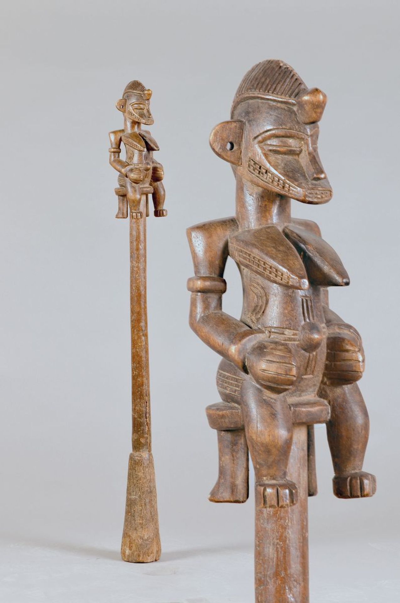 masher of the Senufo, Ivory Coast, probably around 1920-30, carved wood, upper end in shape a seated