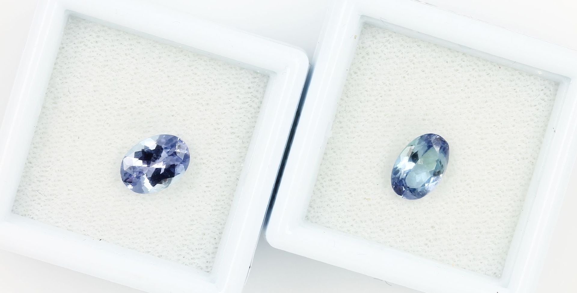 Lot 2 tanzanites , 1 x 1.19 ct, oval bevelled bluish violet (treated), PGTL- expertise; 1 x 1.14 ct,
