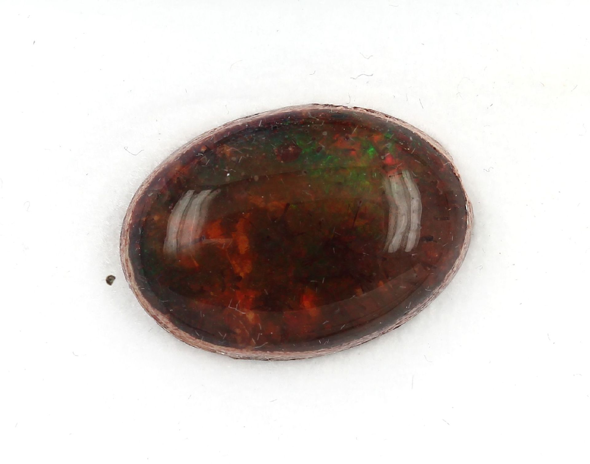 Loose opal approx. 14.94 ct, orange green playof colours Valuation Price: 500, - EUR