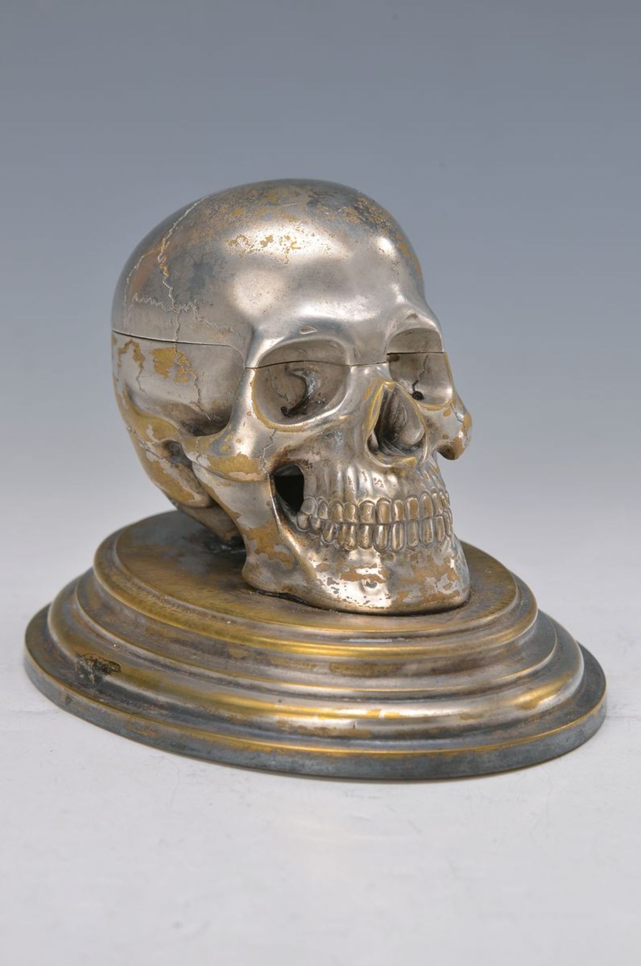 inkstand in shape of a scull, first third of 20th c., brass nickel plated, interior with ceramic