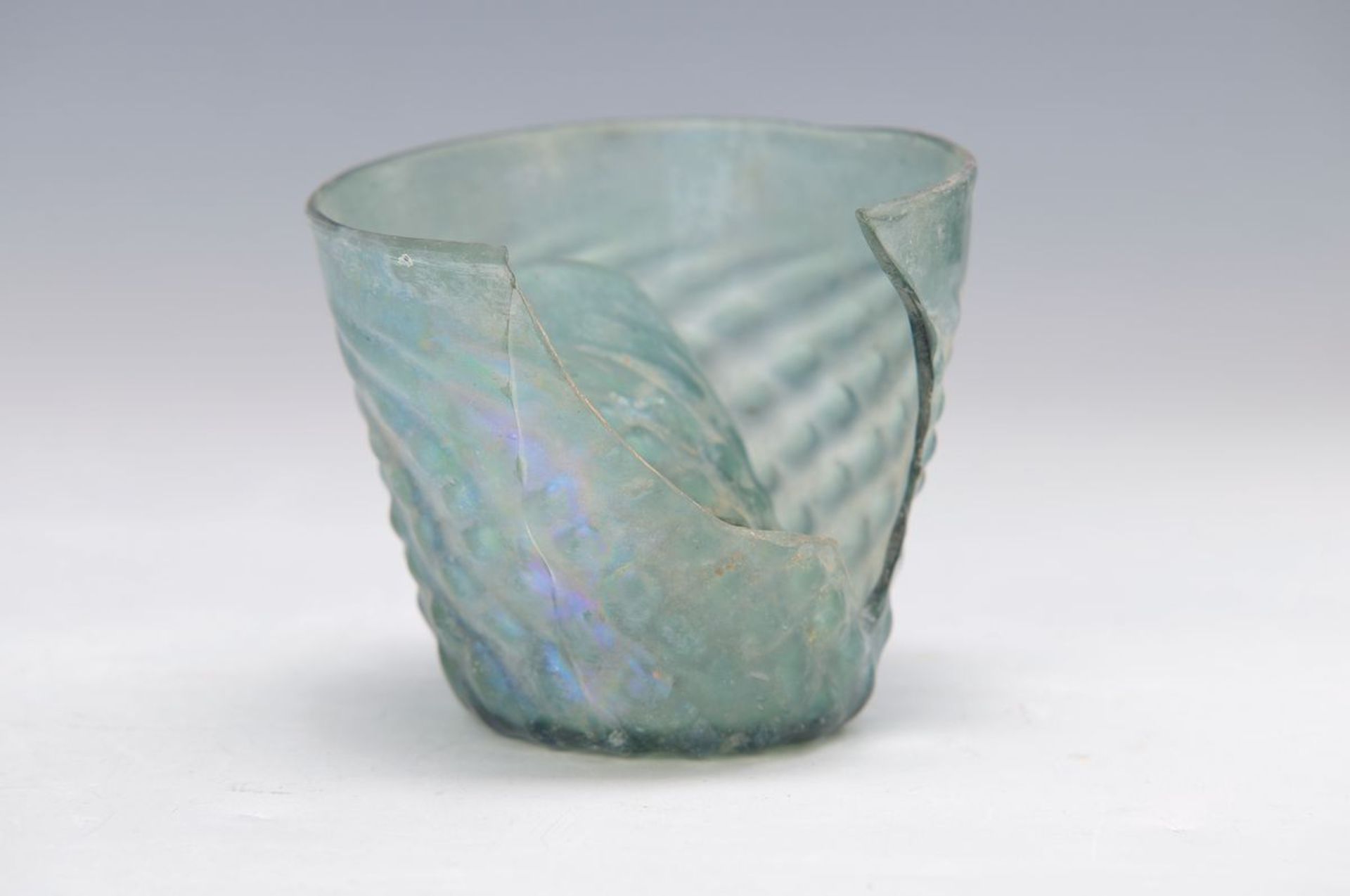 beaker, probably Rhenish, 15/16th c., slightly greenish glass, slightly twisted and with naps decor,