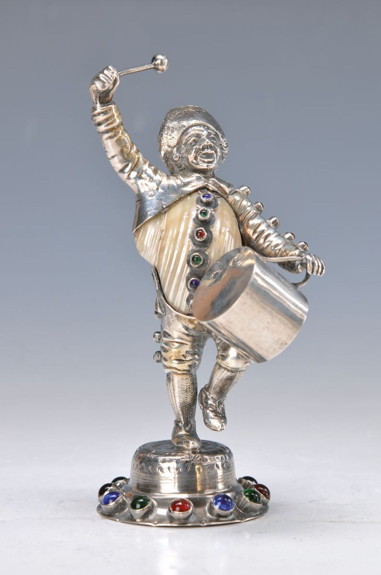 Sculpture of a drummer, probably Italy, 20th c., silver acid tested and clam corpus, studded with