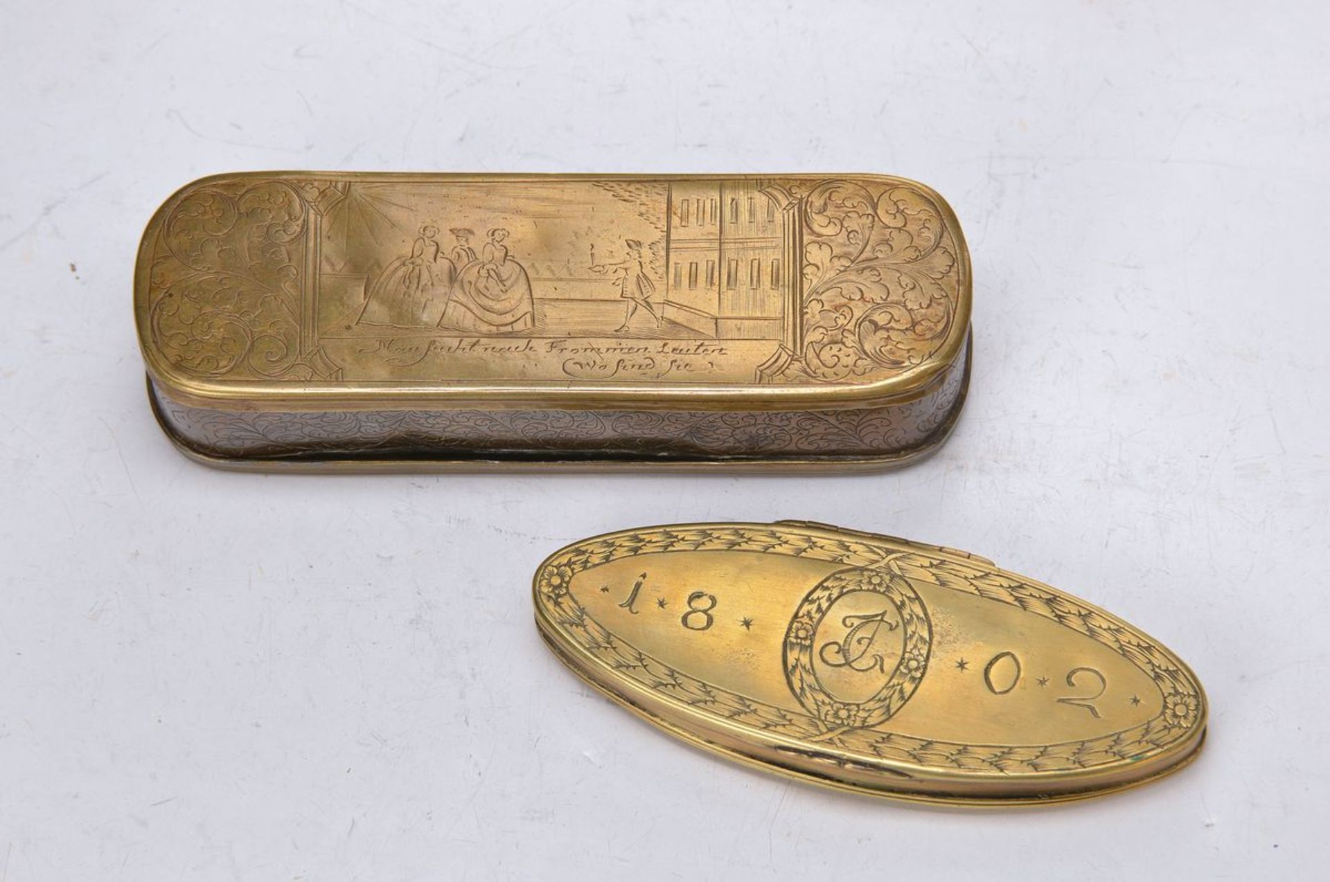 two tobacco boxes, 18. th c. and around 1802, 1 of Iserlohn, brass and copper, with engravings,