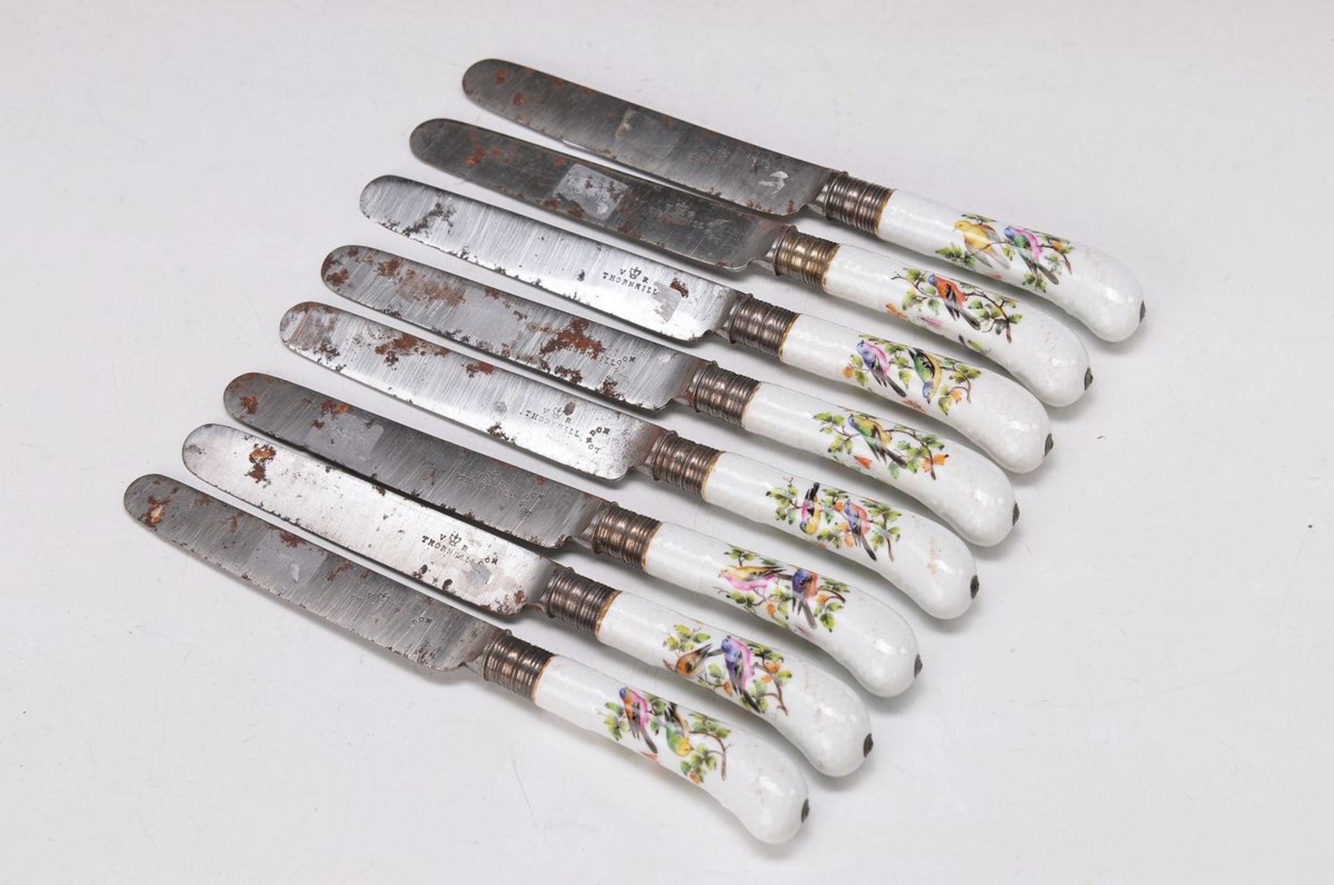 8 knives with porcelain handles, probably England, around 1780, polychrome bird decor, songbirds and