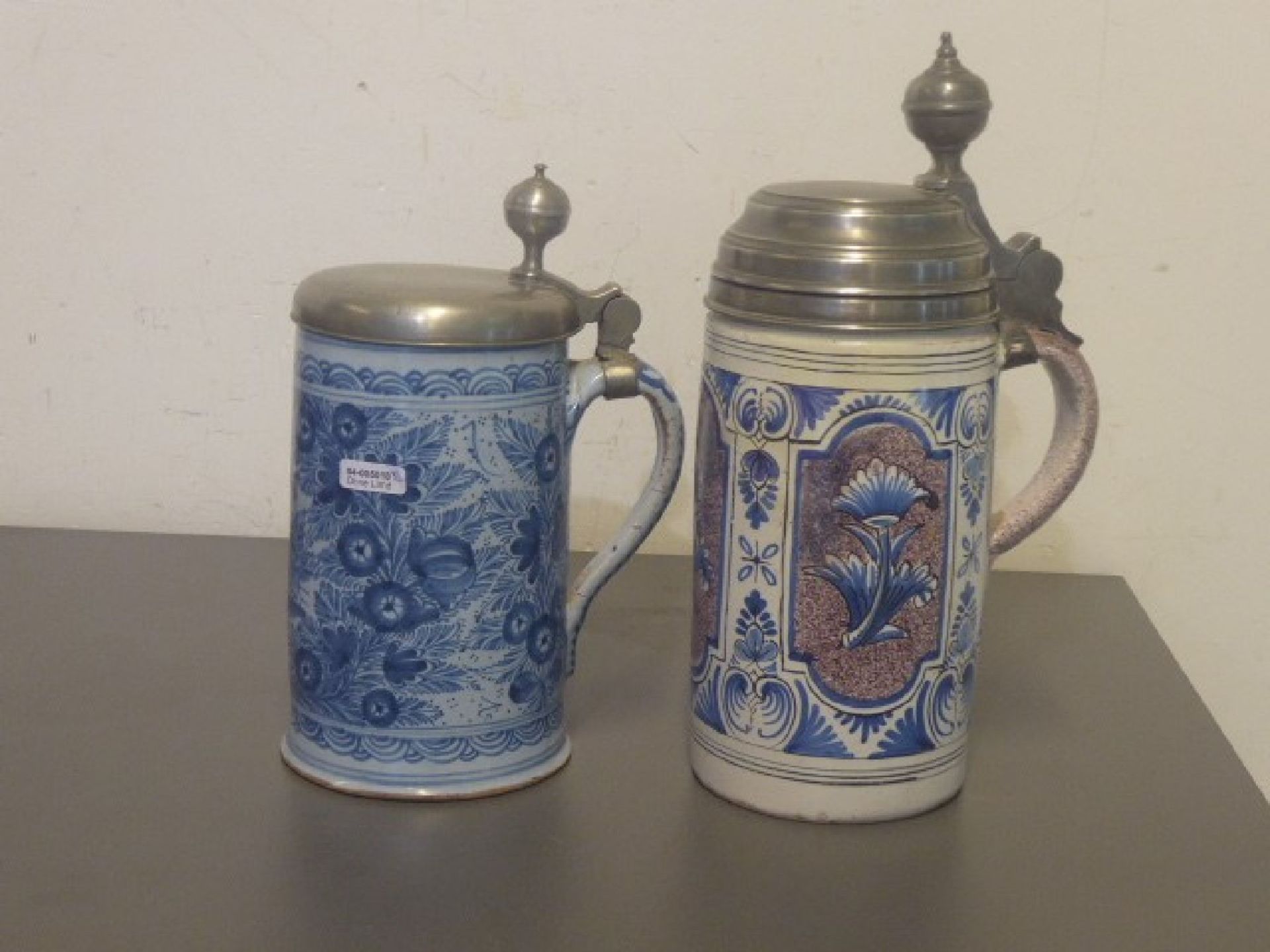 two jugs, Southern Germany, 18. th c., 1 probably Bayreuth, reddish clay with white glaze, blue