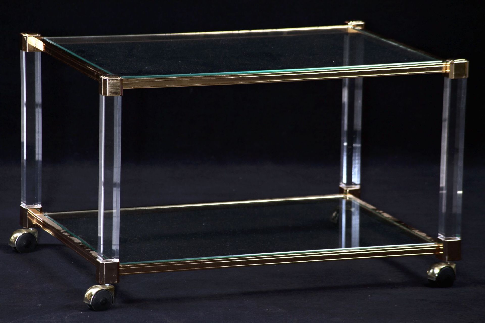 Coffee table, acrylic and brass, 2 inlaid glass plates with polished edges, movable on wheels,