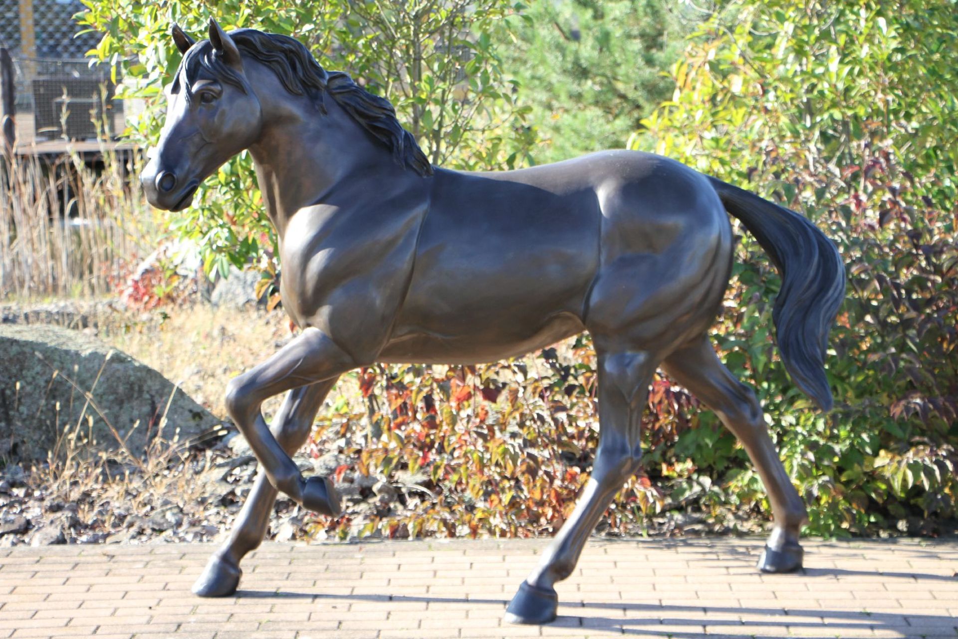 Stallion, bronze, brown and blackish patinated, in trotting representation, naturalistic,