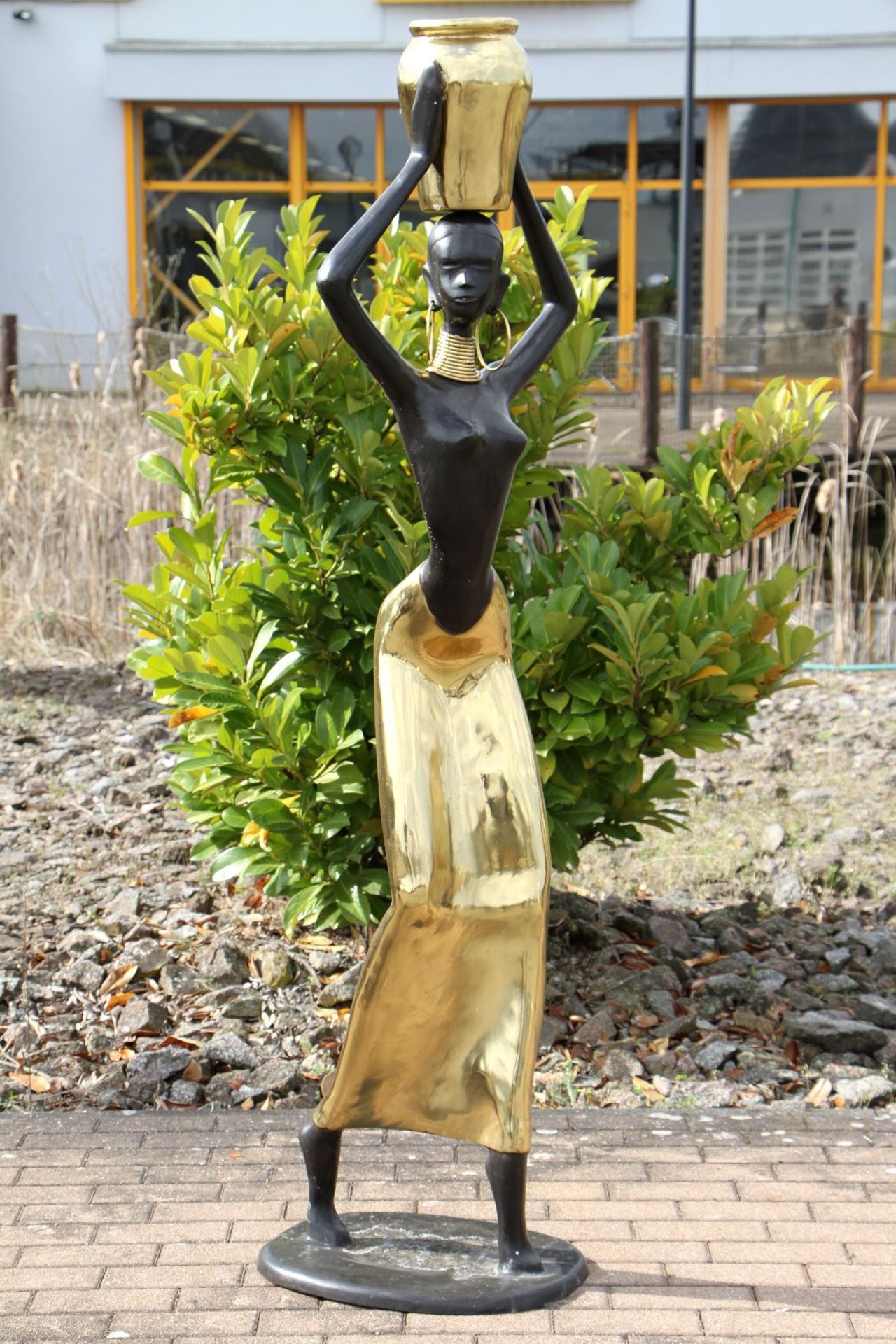 African Water Carrier, modeled on the Ndebele from Zimbabwe, bronze, body and head patinatedblack,