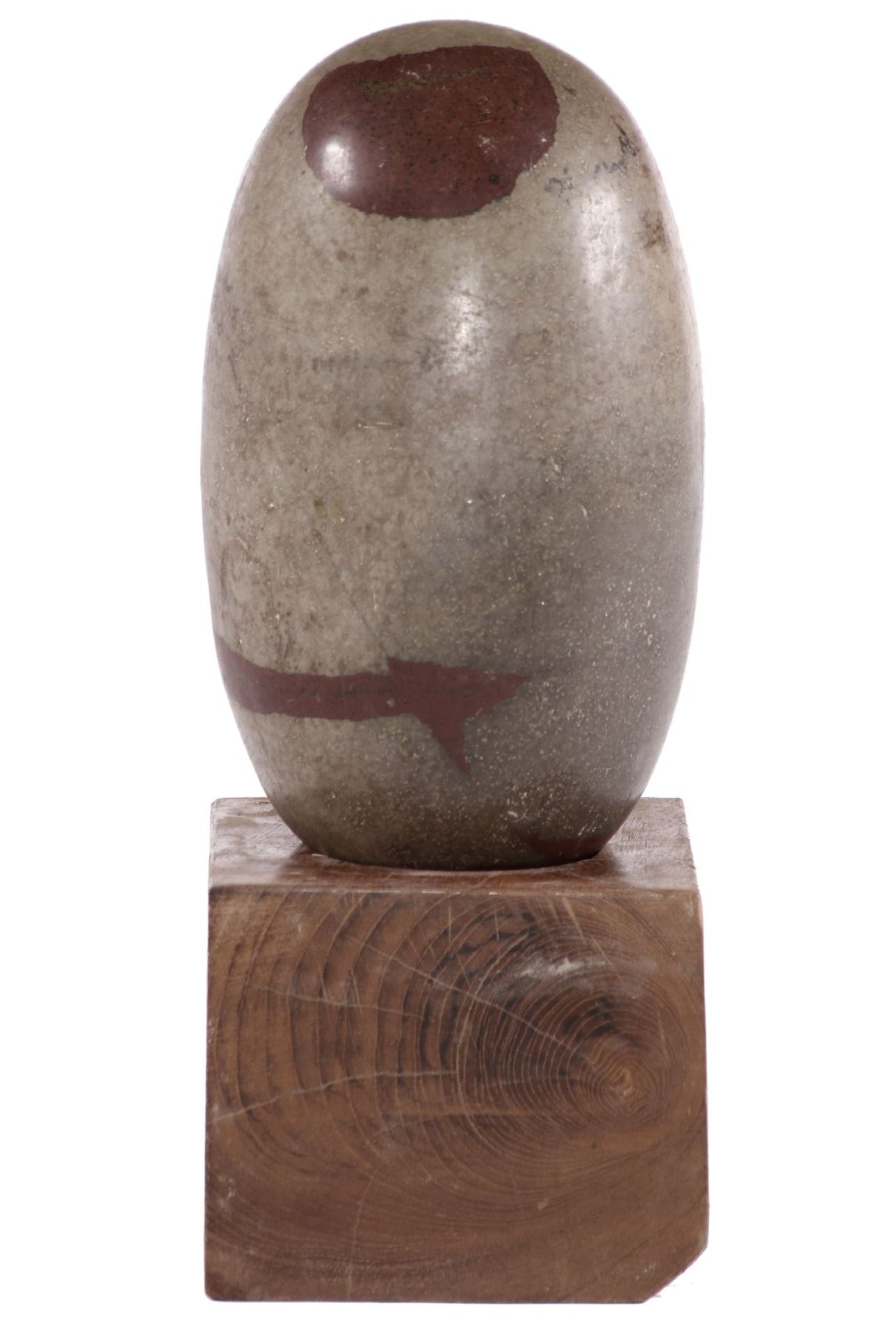 Lingam, natural stone formed by a river bed, symbol of the Hindu Shiva, on a wooden base, approx.