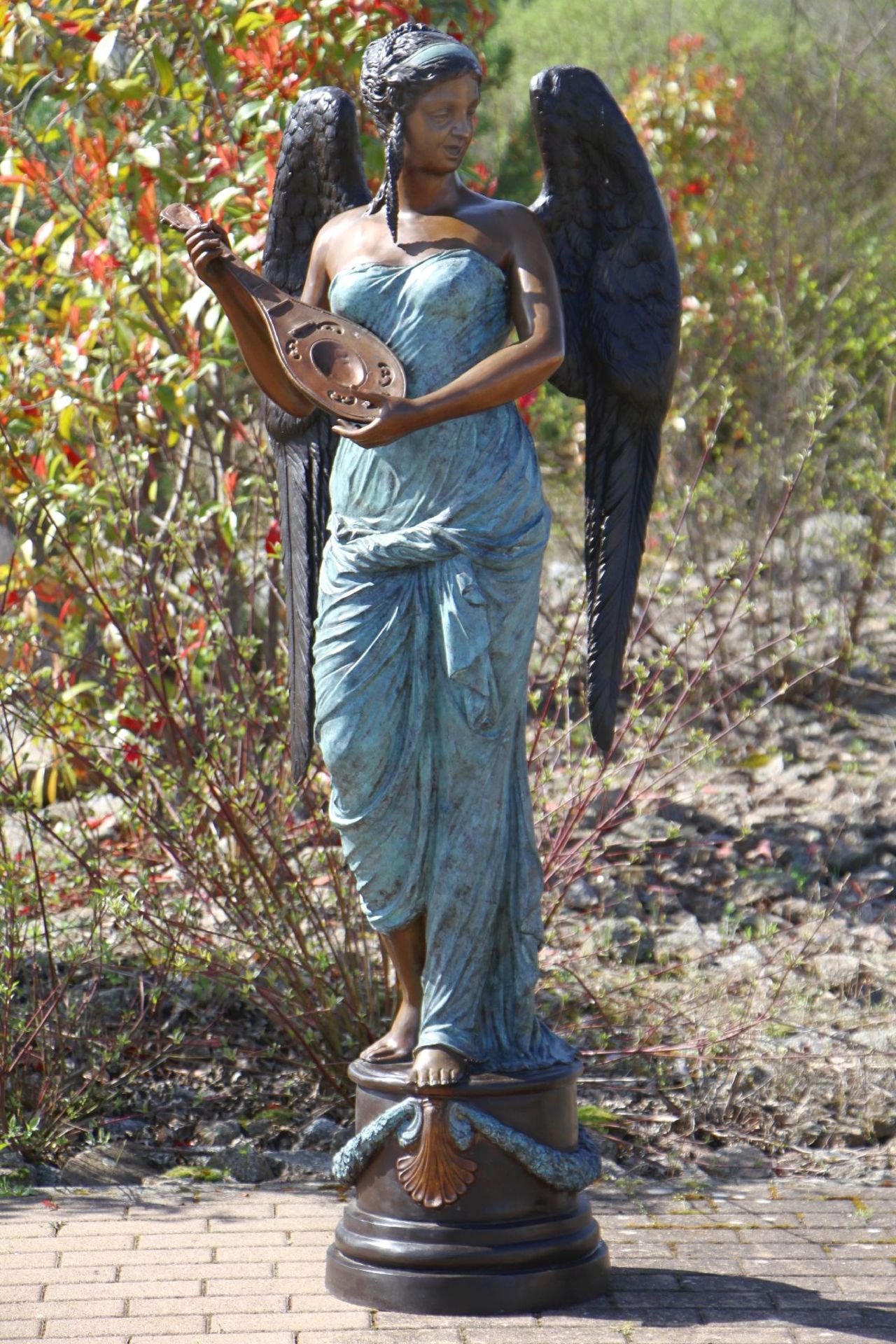 Winged woman with mandolin, bronze, in variousshades of brown and turquoise patinated, detailed