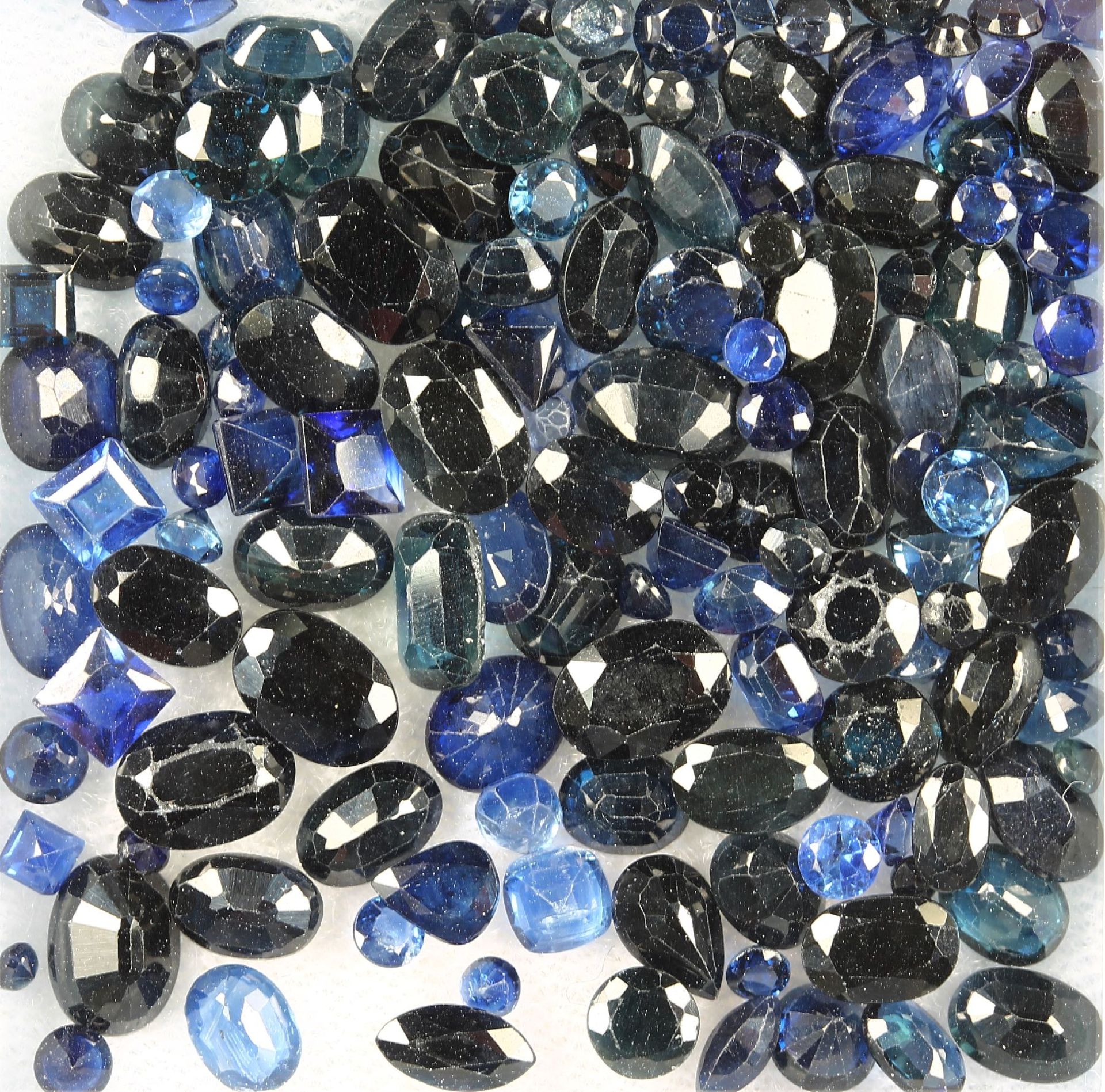 Lot loose bevelled sapphires , total 53.21 ct, in different colour shades, shapes and sizes