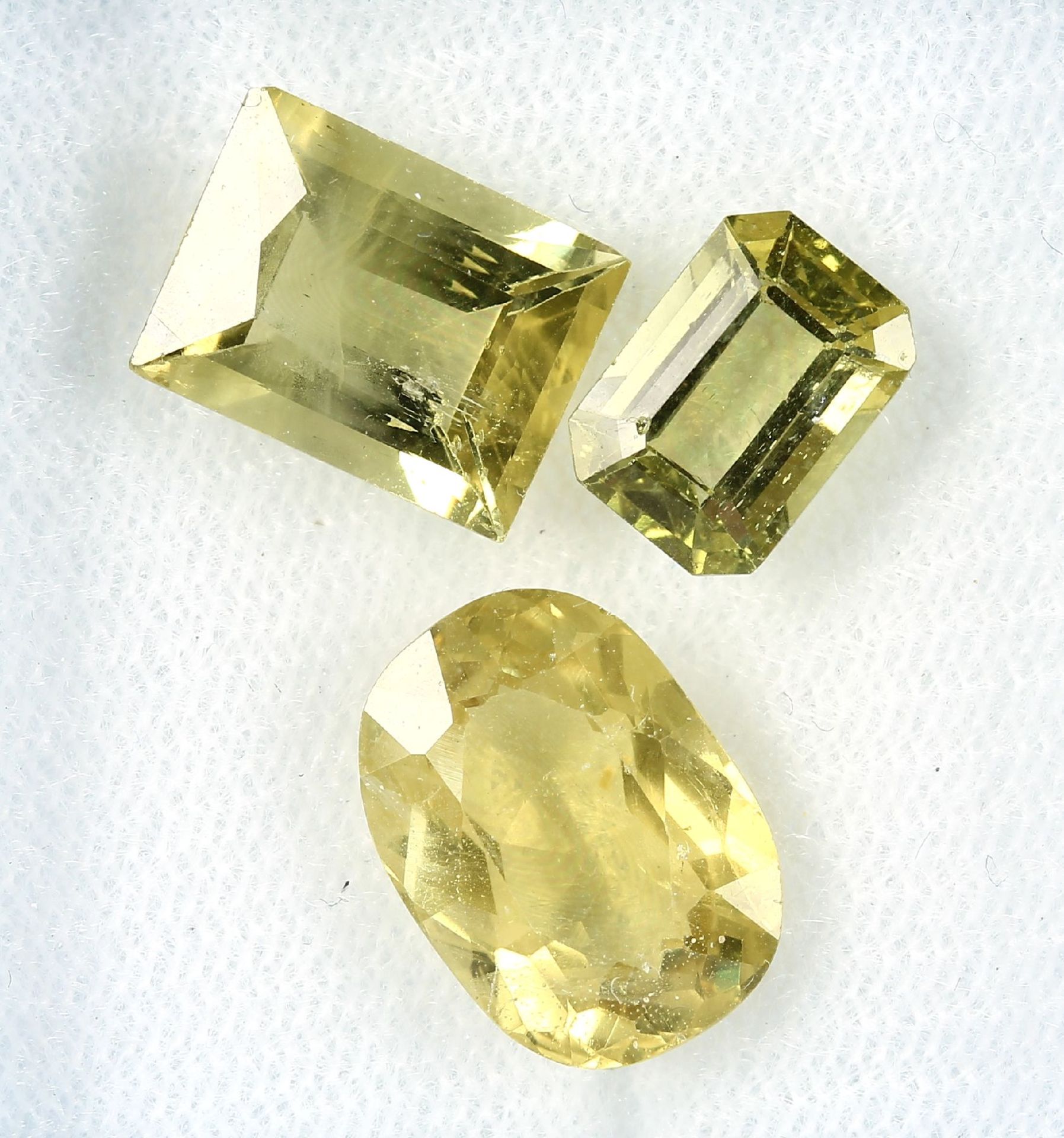 Lot 3 loose bevelled yellow apatites total 13.25 ct, in different cuts Valuation Price: 480, -