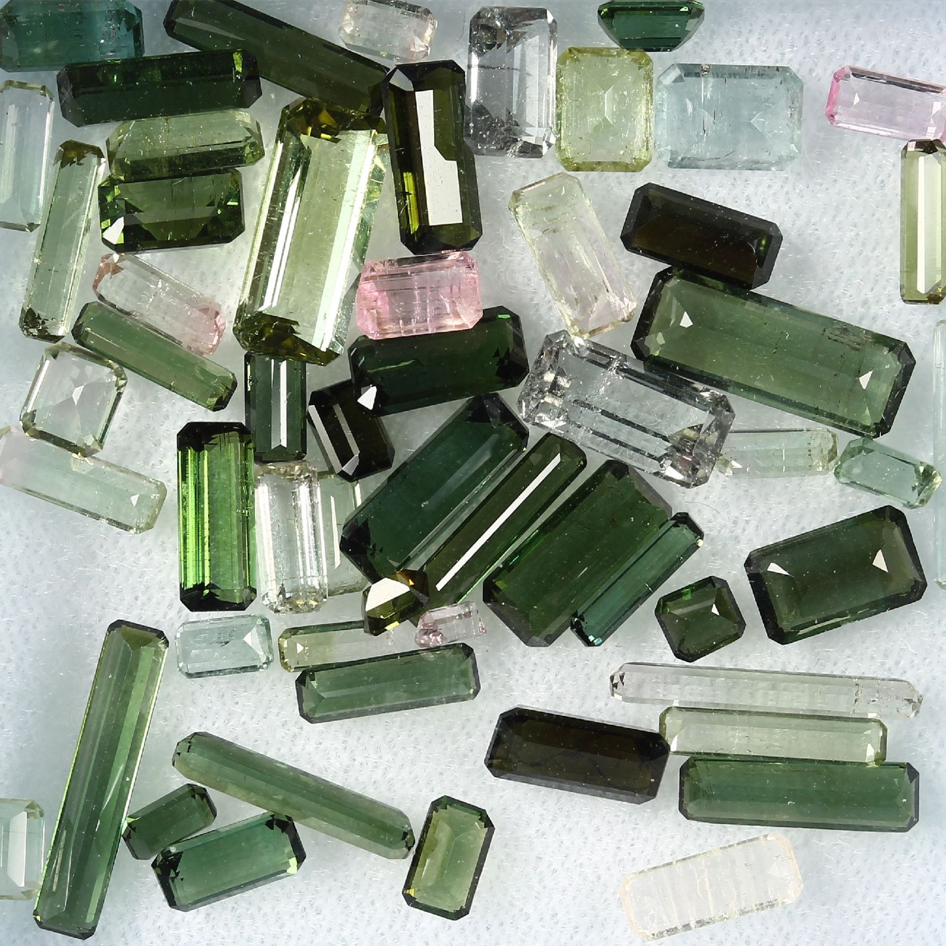 Lot loose bevelled tourmalines, total 31.18 ct, in different colours and sizes, predominant baguette