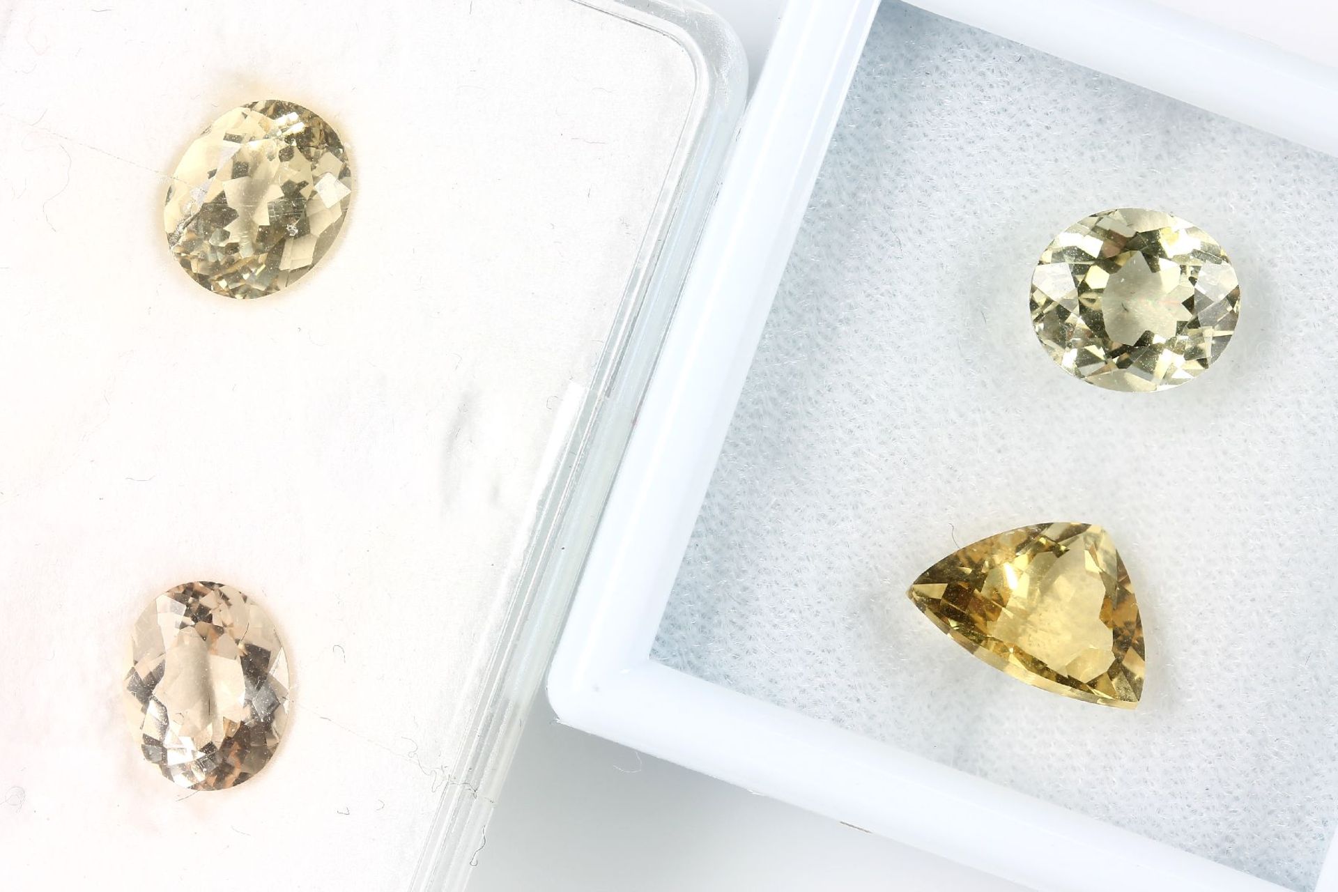 Lot 4 loose bevelled gold beryls , total 11.27 ct, 3 x oval, 1 x triangle Valuation Price: 760, -