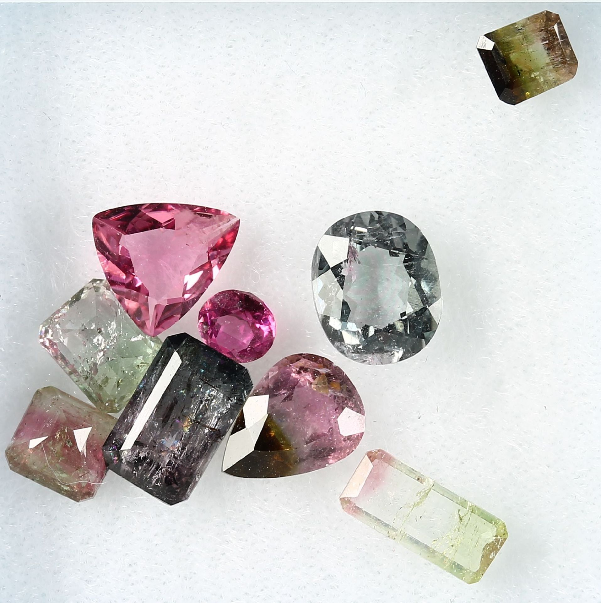 Lot loose bevelled water melon tourmalines ,total 8.96 ct, in different shapes Valuation Price: 800,