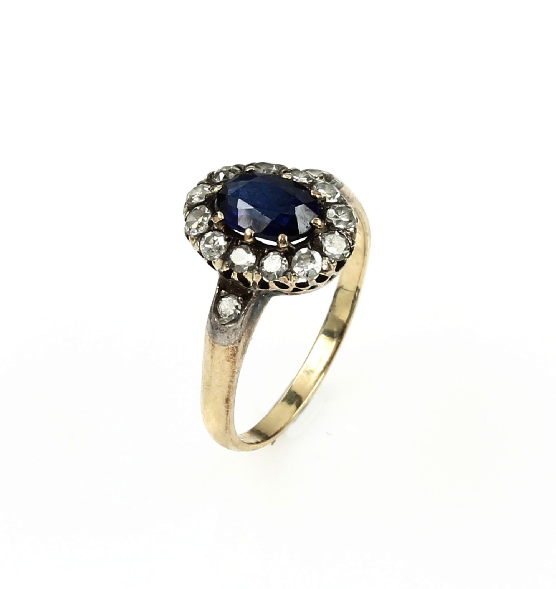 14 kt gold ring with sapphire and diamonds ,YG/WG 585/000, oval bevelled sapphire approx. 0.50 ct,