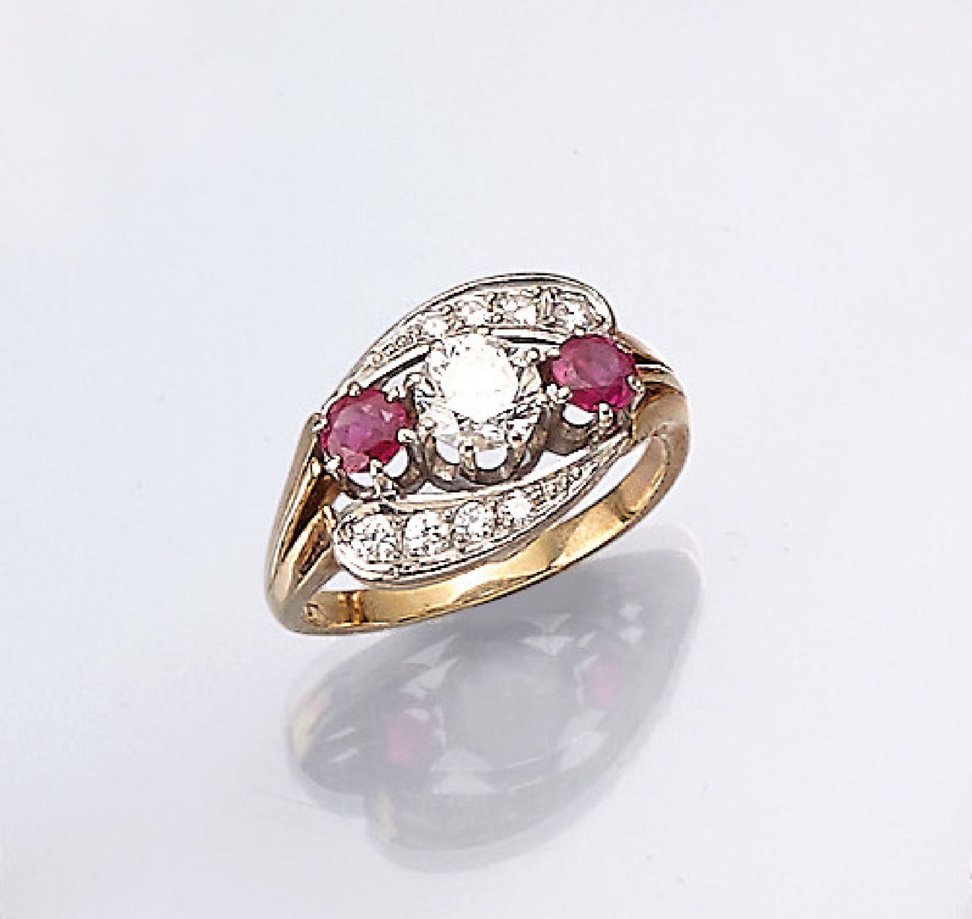 14 kt gold ring with rubies and brilliants ,YG/WG 585/000, centered one brilliant approx. 0.50 ct, 8