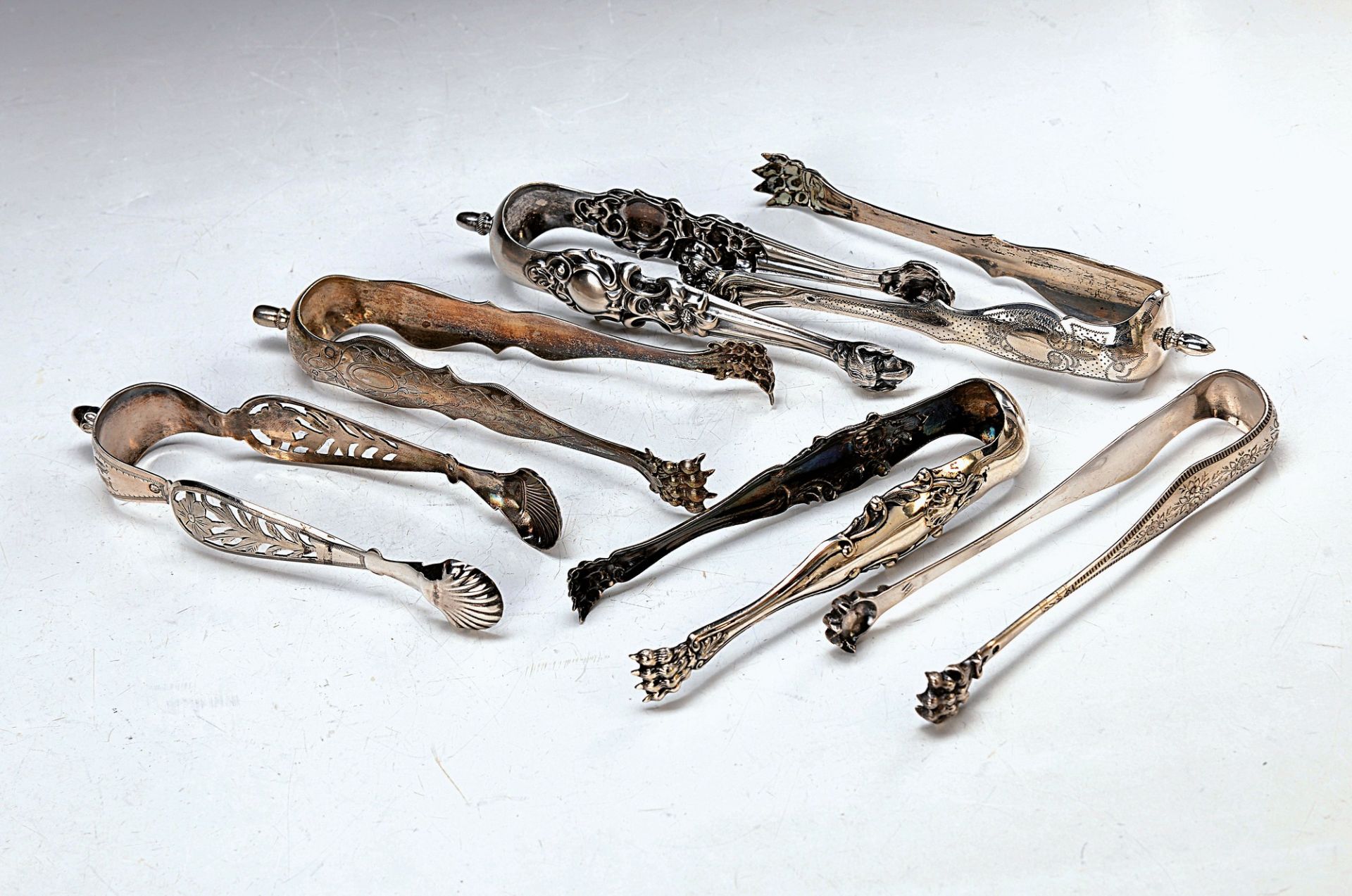 collection of 6 different sugar tongs, France,2.h.19.th c., four finely engraved, one in sawn