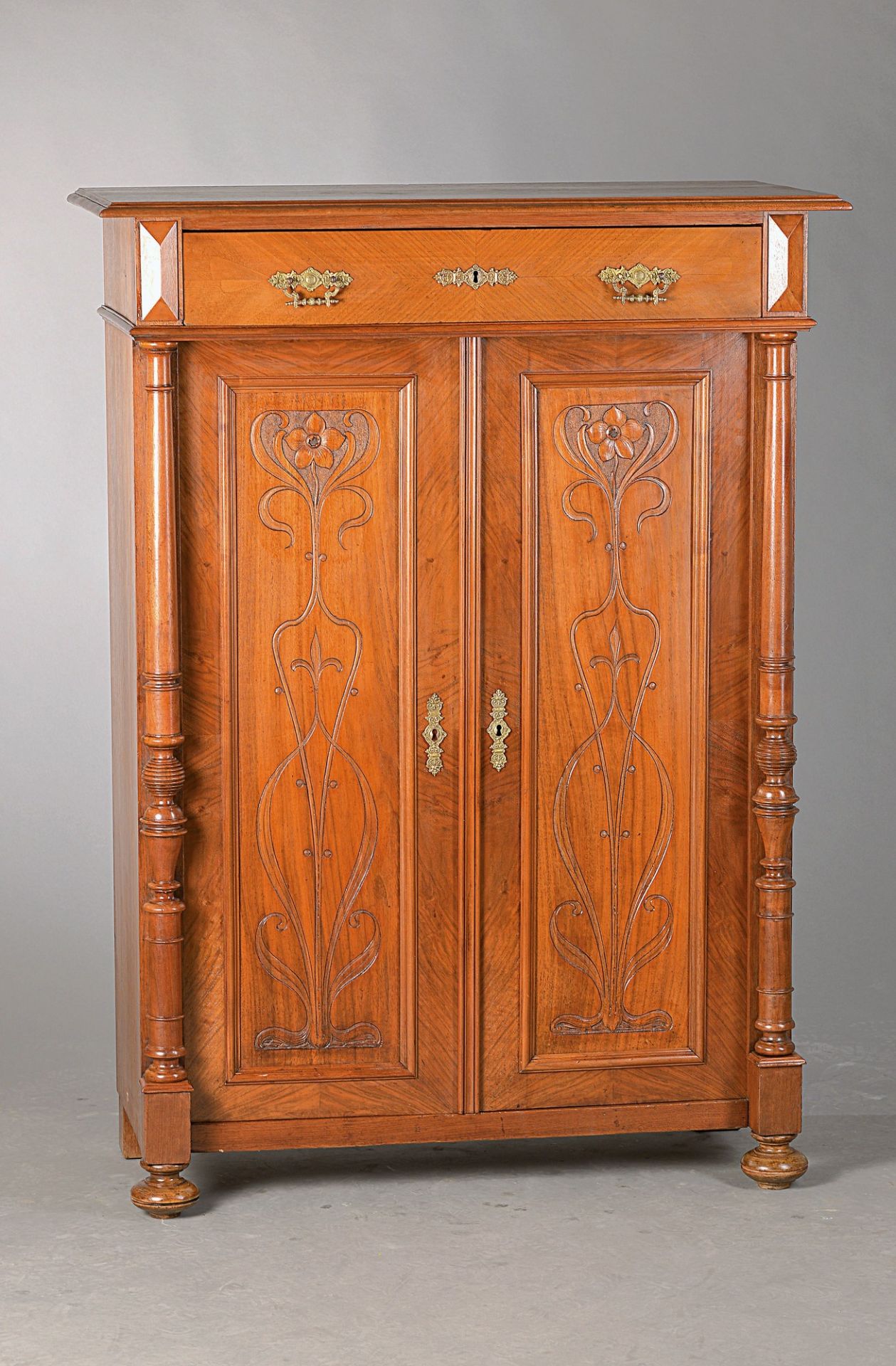 Vertiko, Art Nouveau around 1900, walnut veneer , doors with carved floral decor, one drawers, minor